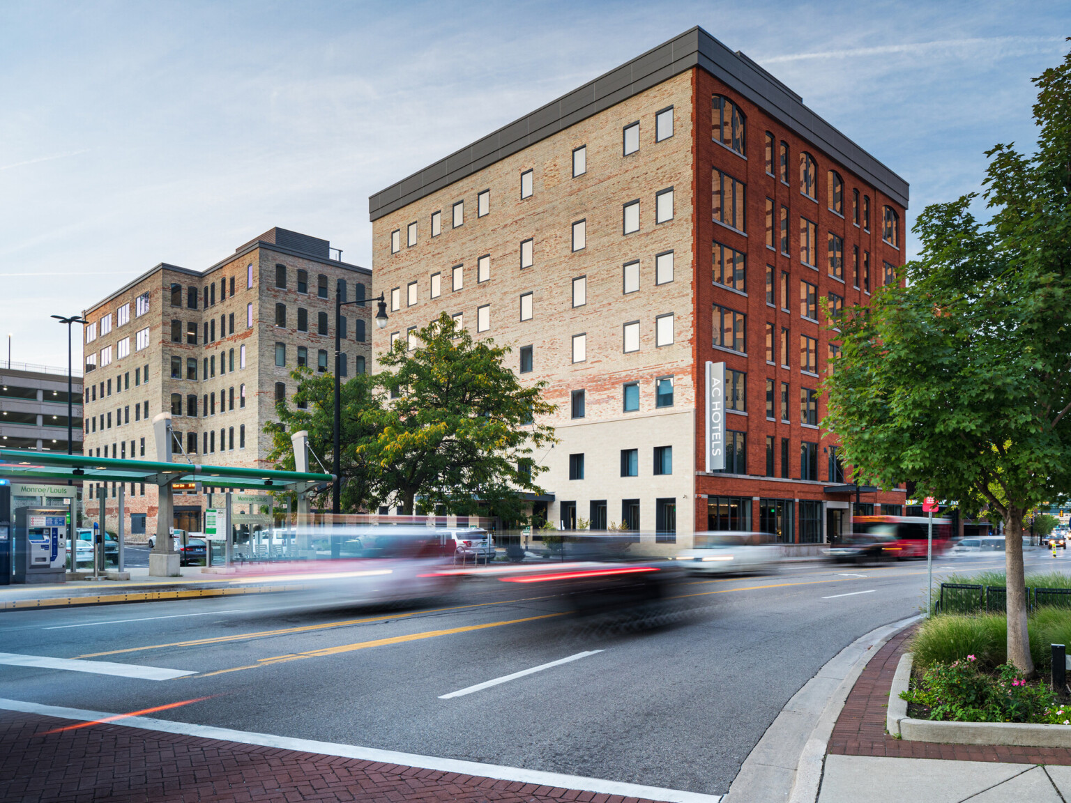 A pair of brick façade buildings, built in 1890, once a warehouse is now an hotel in a bustling downtown.