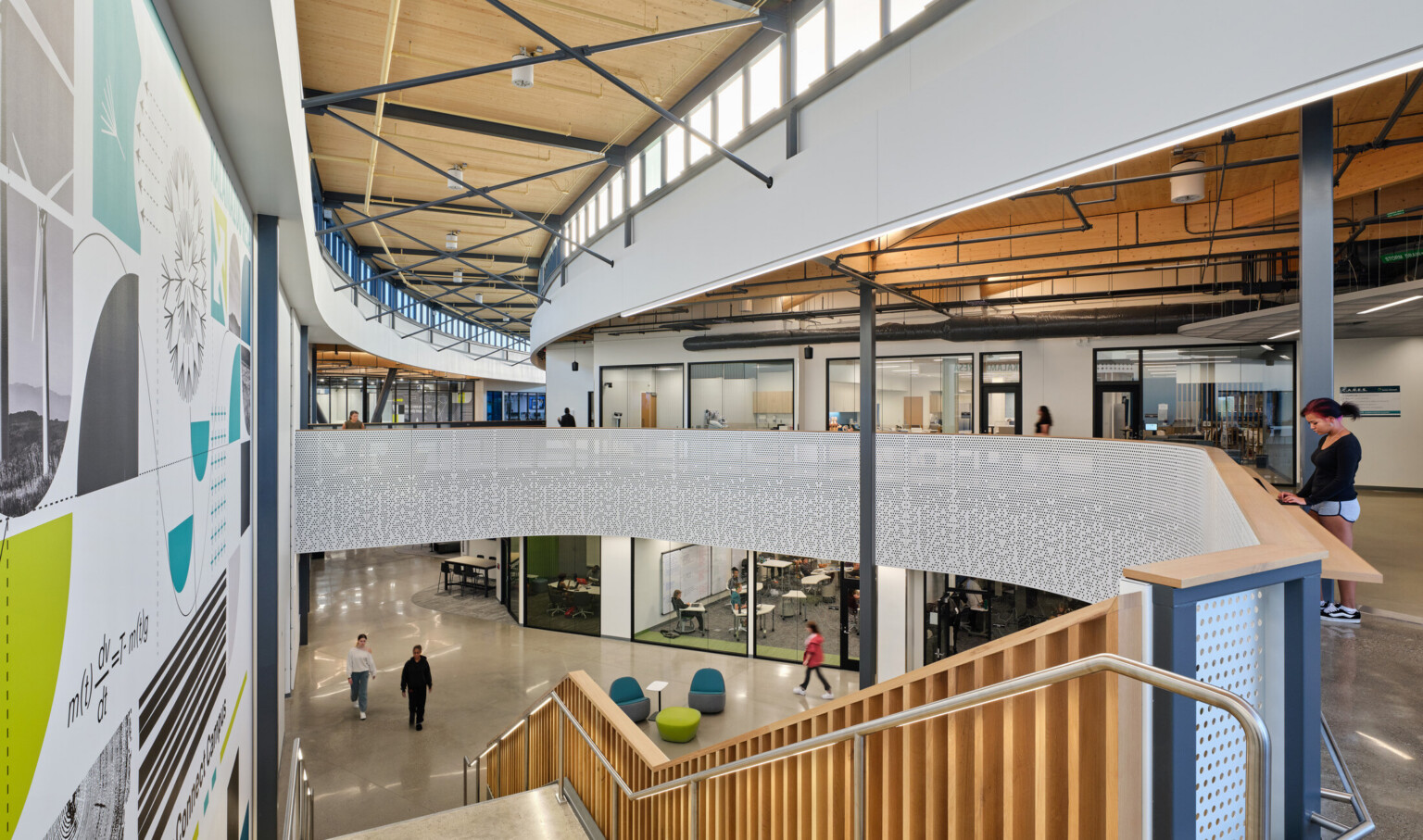 Kalamazoo RESA career technical education central hallway featuring exposed wood structure, natural materials, and biophilic design elements in a double height central hallway space