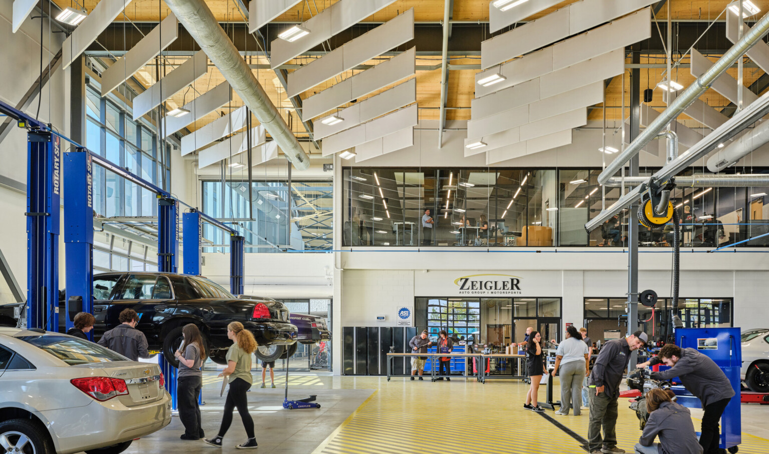 automotive lab space in a career and technical education school; high-bay space for automotive, career prep, hands-on learning, automotive training