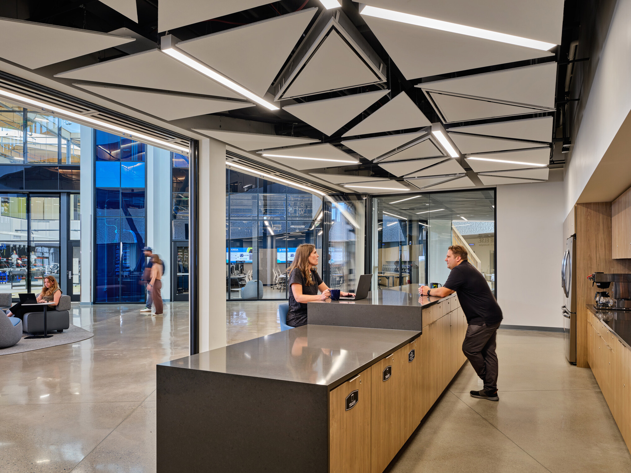 Kalamazoo RESA career technical education community table; featuring exposed wood structure, natural materials, and biophilic design elements; modular community seating