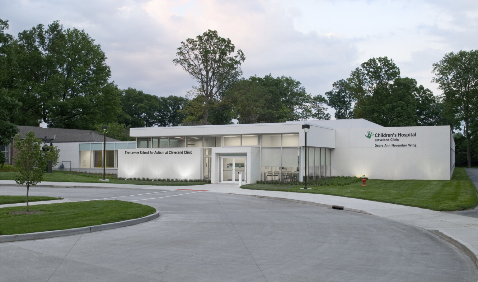 Entrance to Cleveland Clinic Lerner School for Autism, a white single story building with windows at front