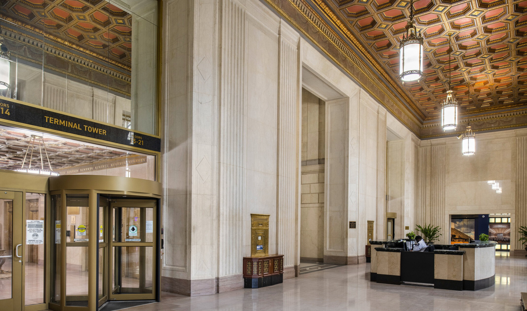 interior photo of an apartment building lobby; historic elements with modern furniture and design