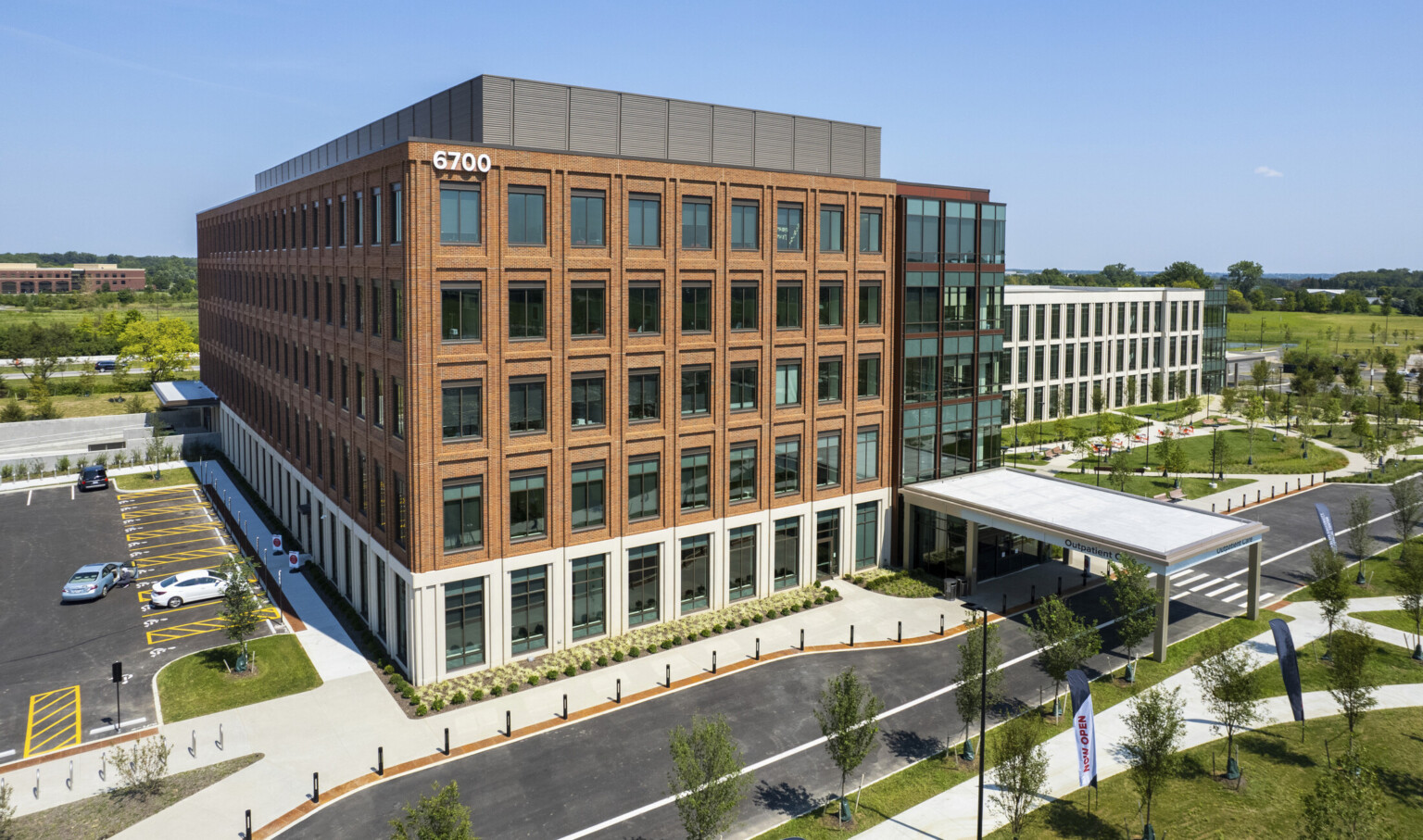 Exterior of Ohio State University Wexner Medical Center Outpatient Care Facilities, a multistory brick building with rows of windows Exterior of Ohio State University Wexner Medical Center Outpatient Care Facilities, a multistory brick building with rows of windows