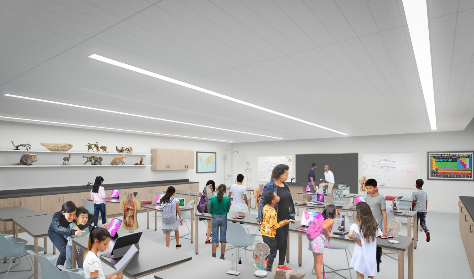 interactive museum room with facilitator and children at work tables with web tablets, white room with overhead tube lighting interactive museum room with facilitator and children at work tables with web tablets, white room with overhead tube lighting
