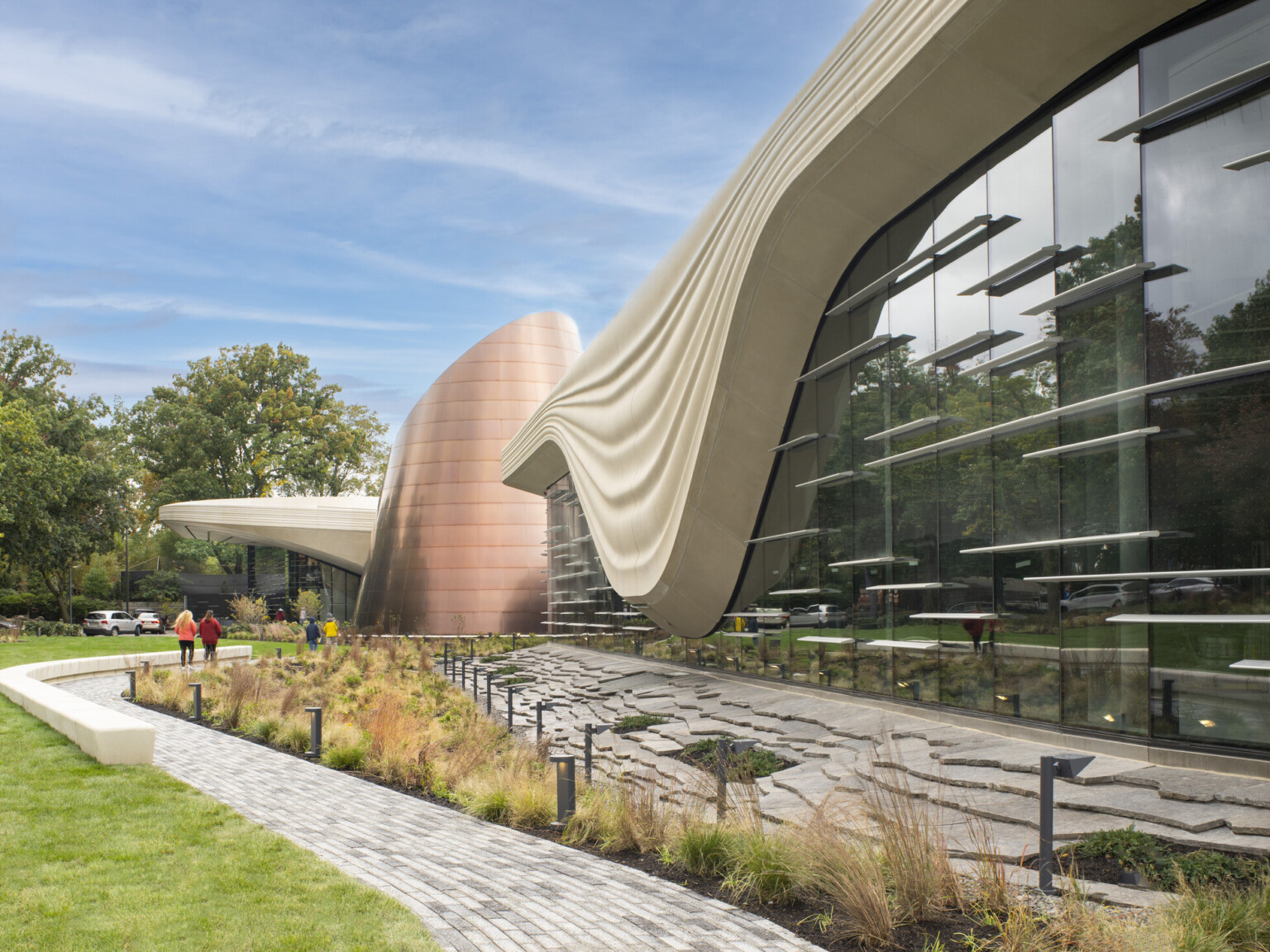 Exterior of the Cleveland Museum of Natural History showing lush grass and large window