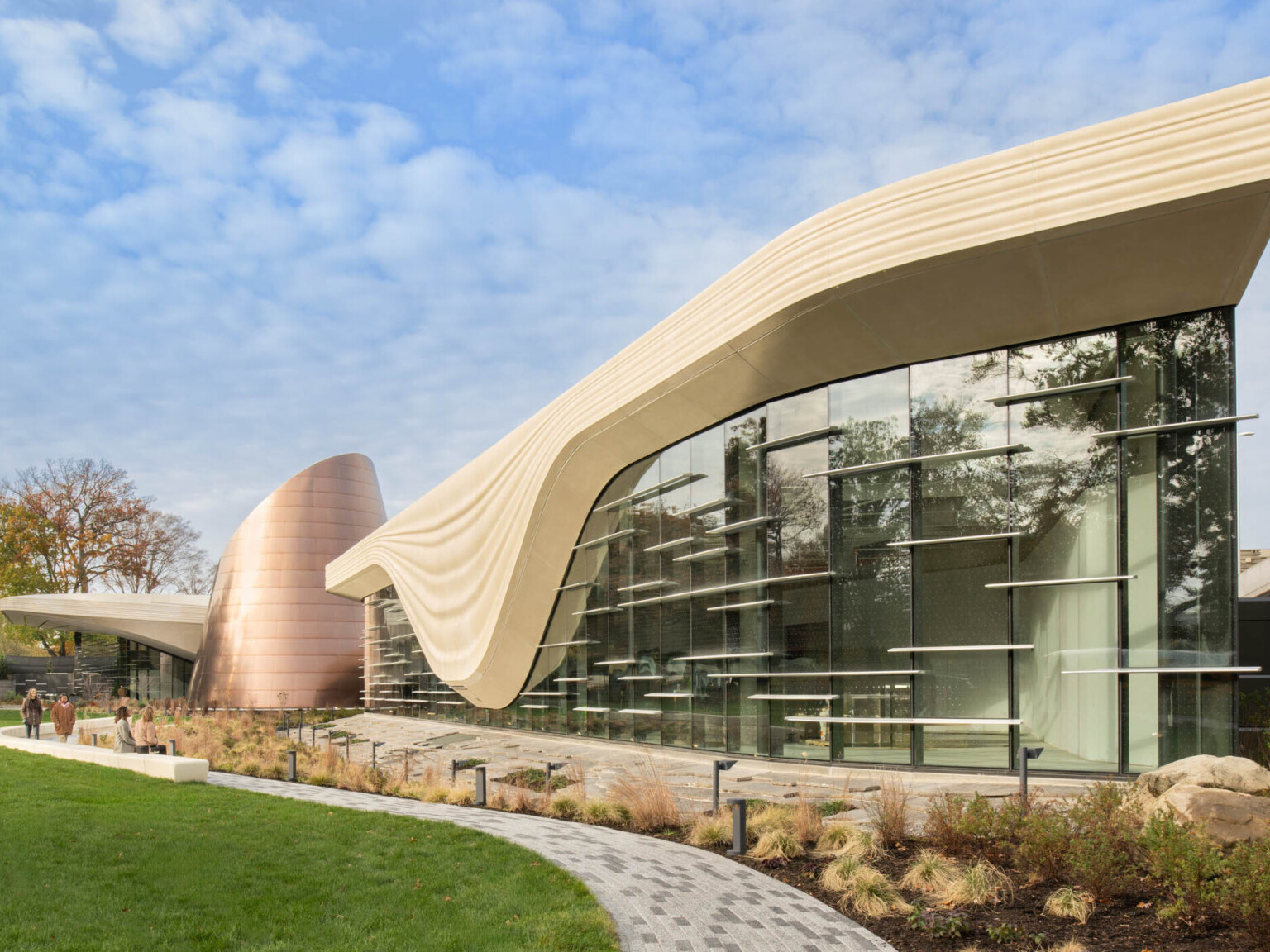 Exterior of the Cleveland Museum of Natural History showing lush grass and large window