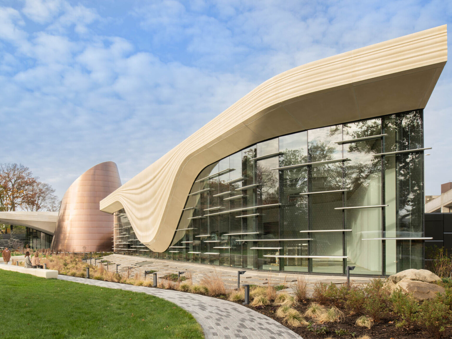 Exterior of the Cleveland Museum of Natural History showing lush grass and large window