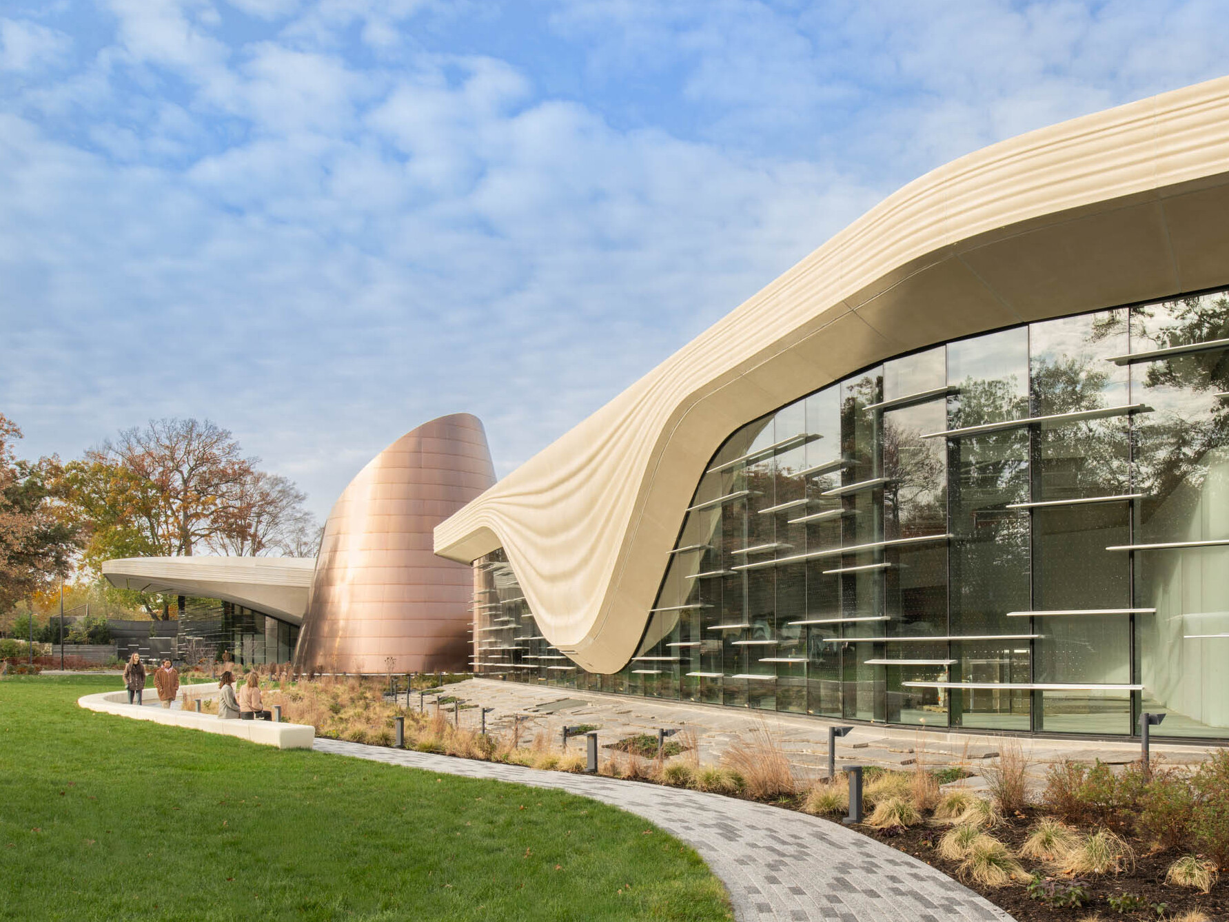 Exterior of the Cleveland Museum of Natural History showing lush grass and large window