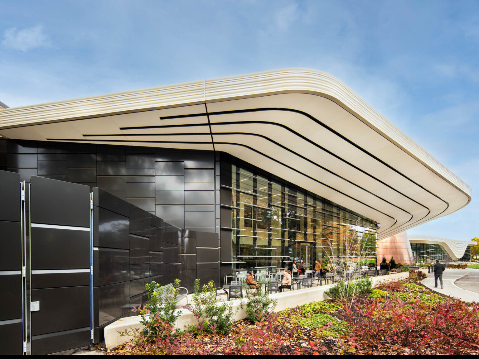 Exterior of the Cleveland Museum of Natural history showing a wall of windows with a white awning