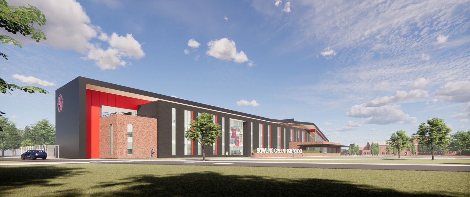 Bowling Green High School a brick building with dark wrap facade and red accents, logo on double height windows