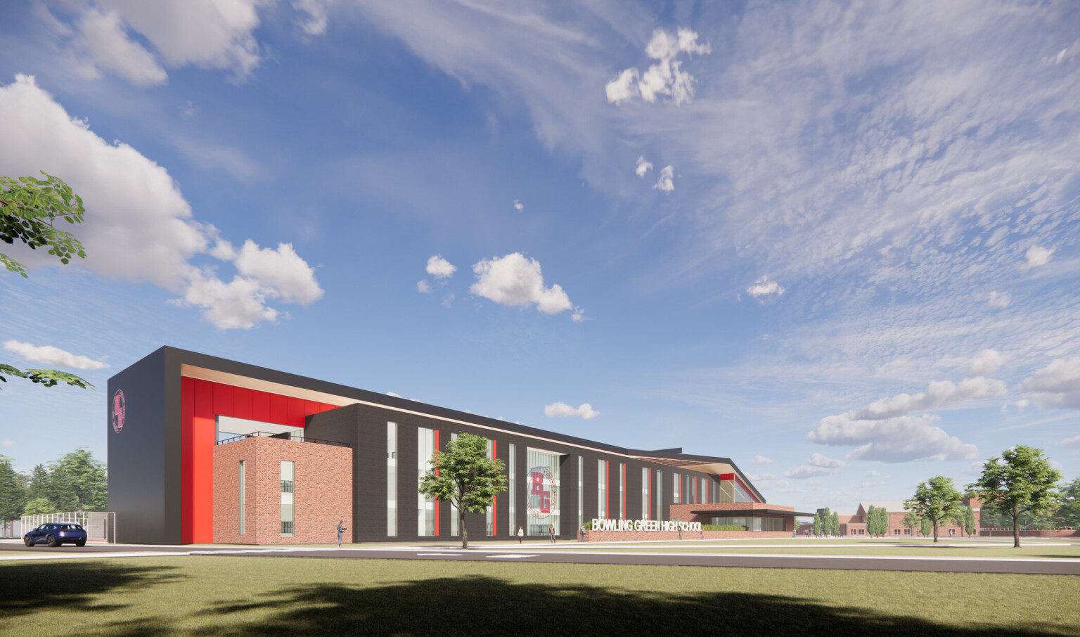 Bowling Green High School a brick building with dark wrap facade and red accents, logo on double height windows Bowling Green High School a brick building with dark wrap facade and red accents, logo on double height windows