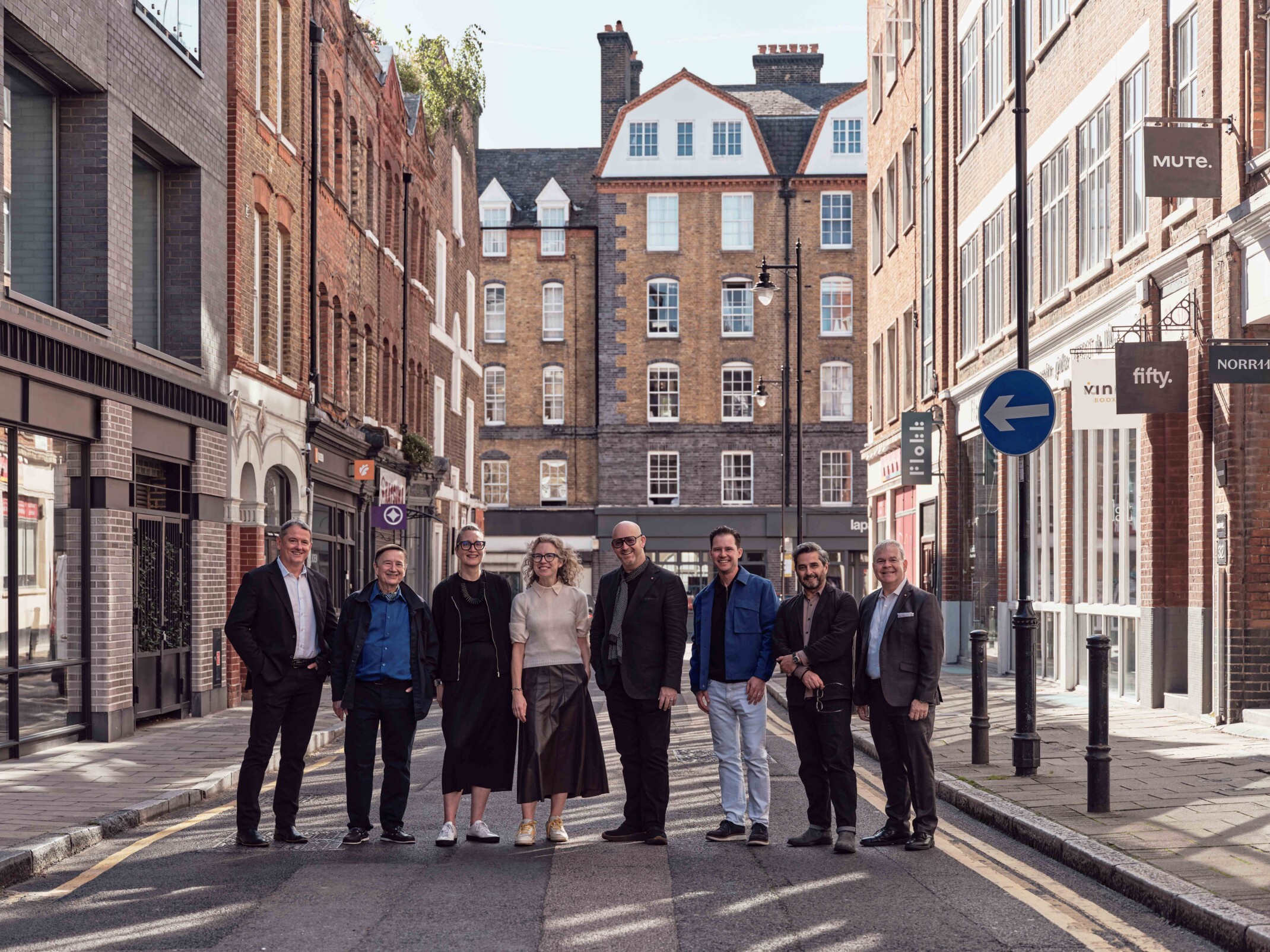 group photo of designers standing in a London street