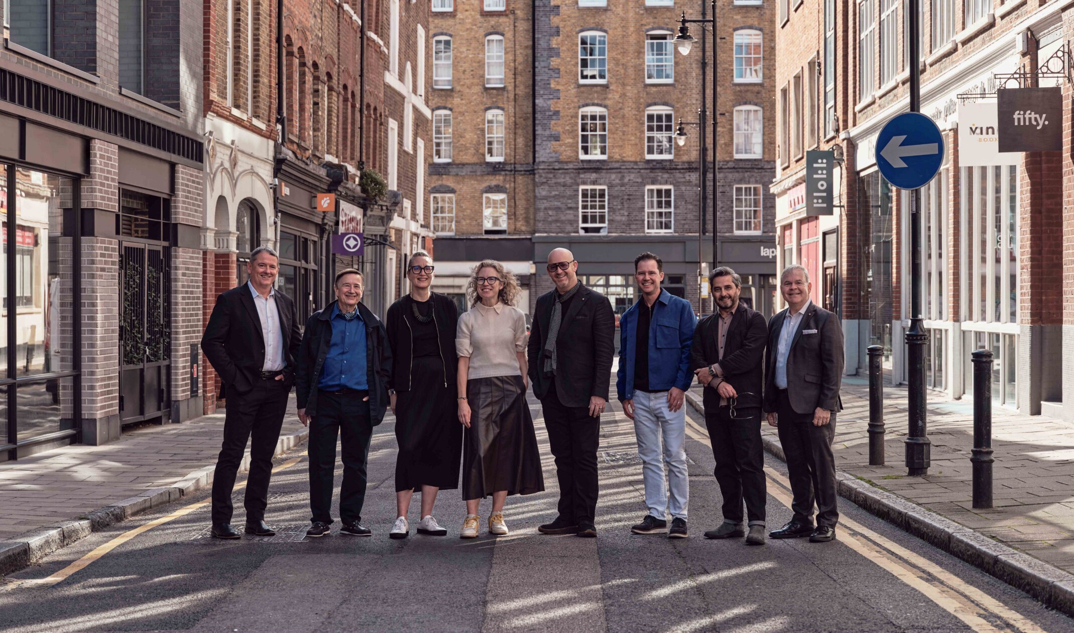 group photo of designers standing in a London street