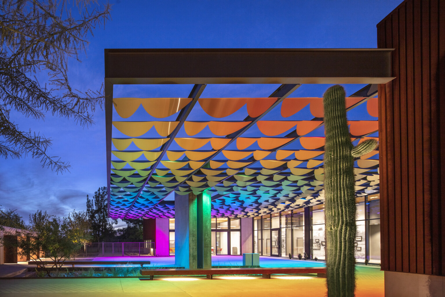 Infinite Shade art installation, colorful array of lights and metal pieces create a shading structure for passive cooling; dlr group design Infinite Shade art installation, colorful array of lights and metal pieces create a shading structure for passive cooling; dlr group design
