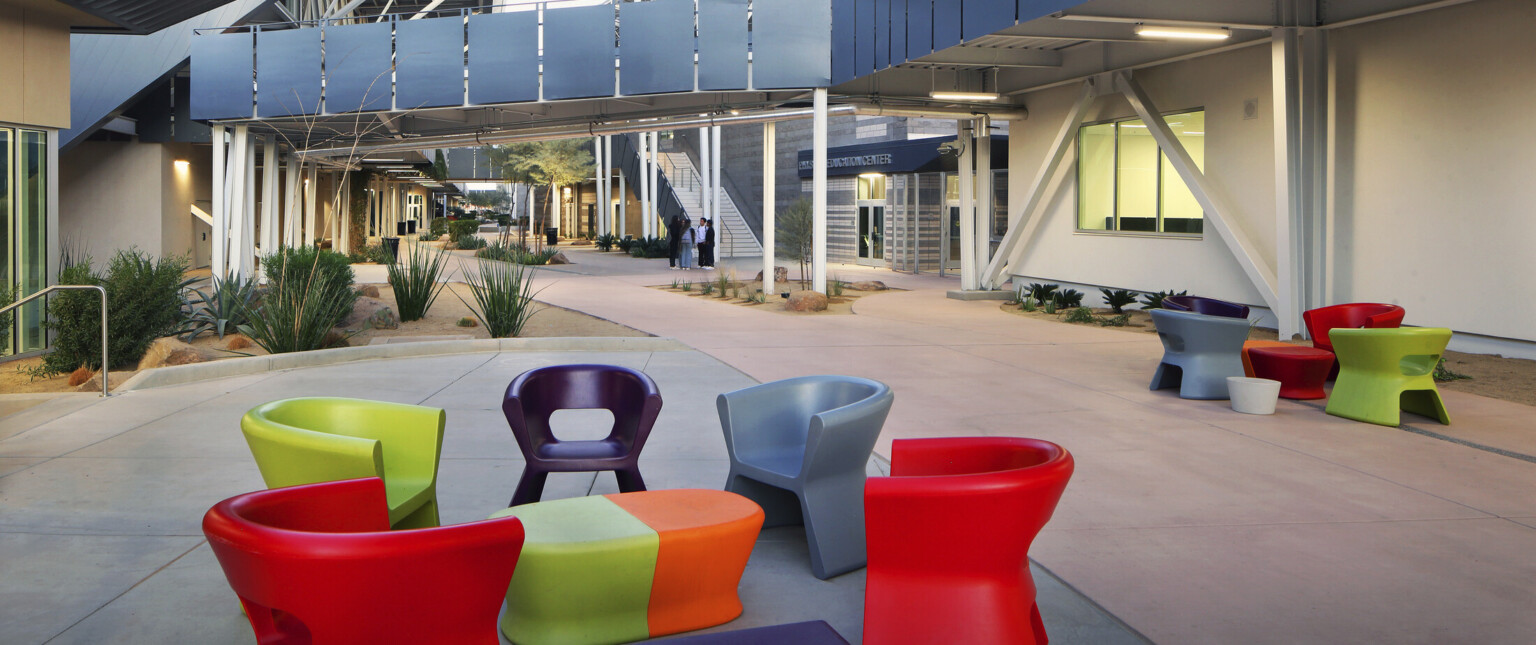 Beautiful outdoor courtyard, adorned with a beautiful palette of colorful tables and chairs