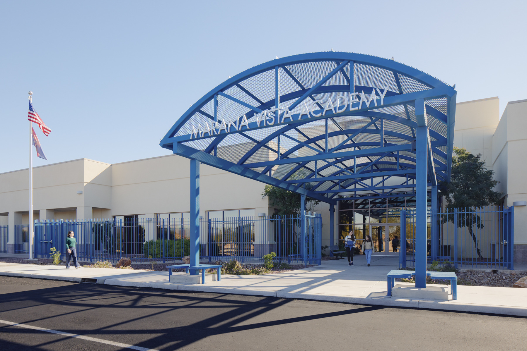Exterior of Marana Vista Academy; blue steel overhang entrance with white modern school building