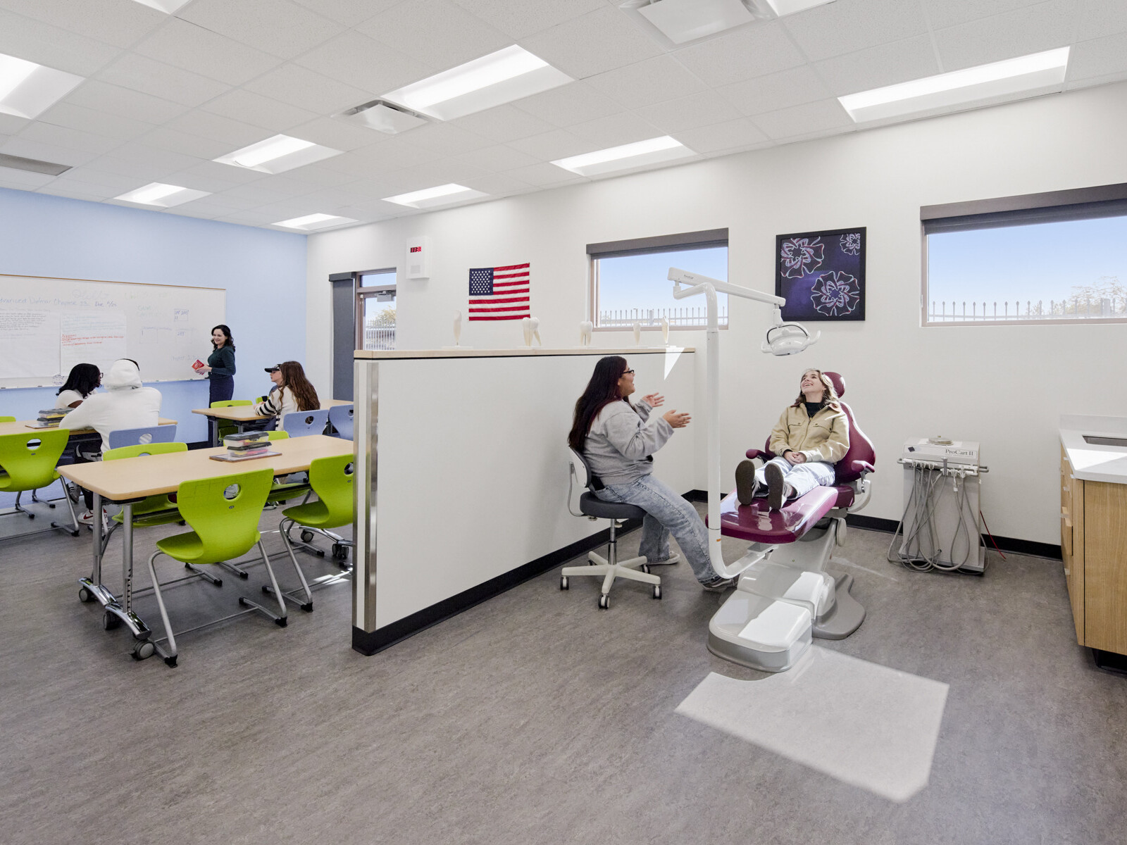 technical classroom at Marana Vista Academy with a doctors visit simulation pod and desks in the background