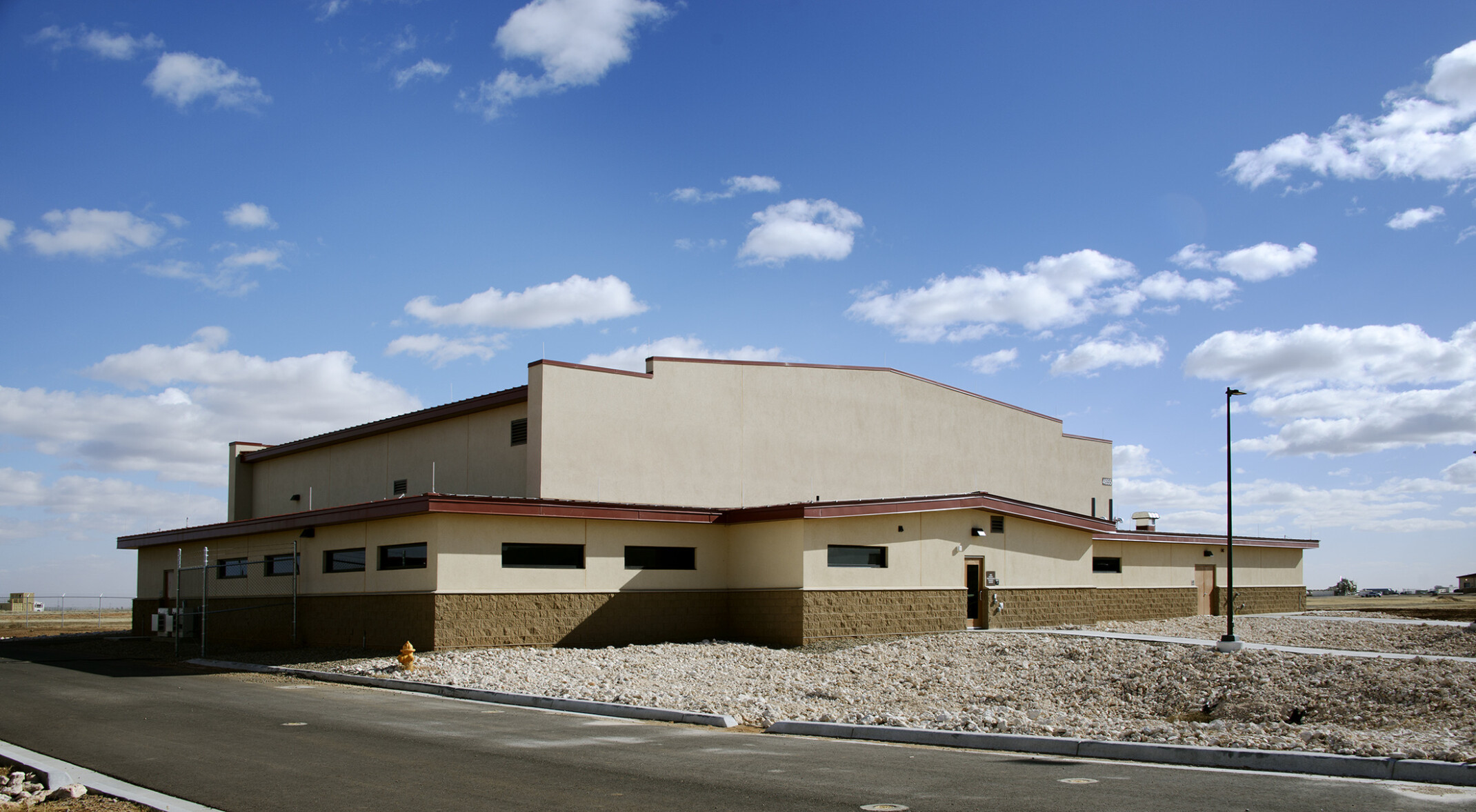 The Cannon Air Force Base Squadron Operations Facility uses mission-style architecture to meld seamlessly with the surrounding high plains and blue skies of eastern New Mexico