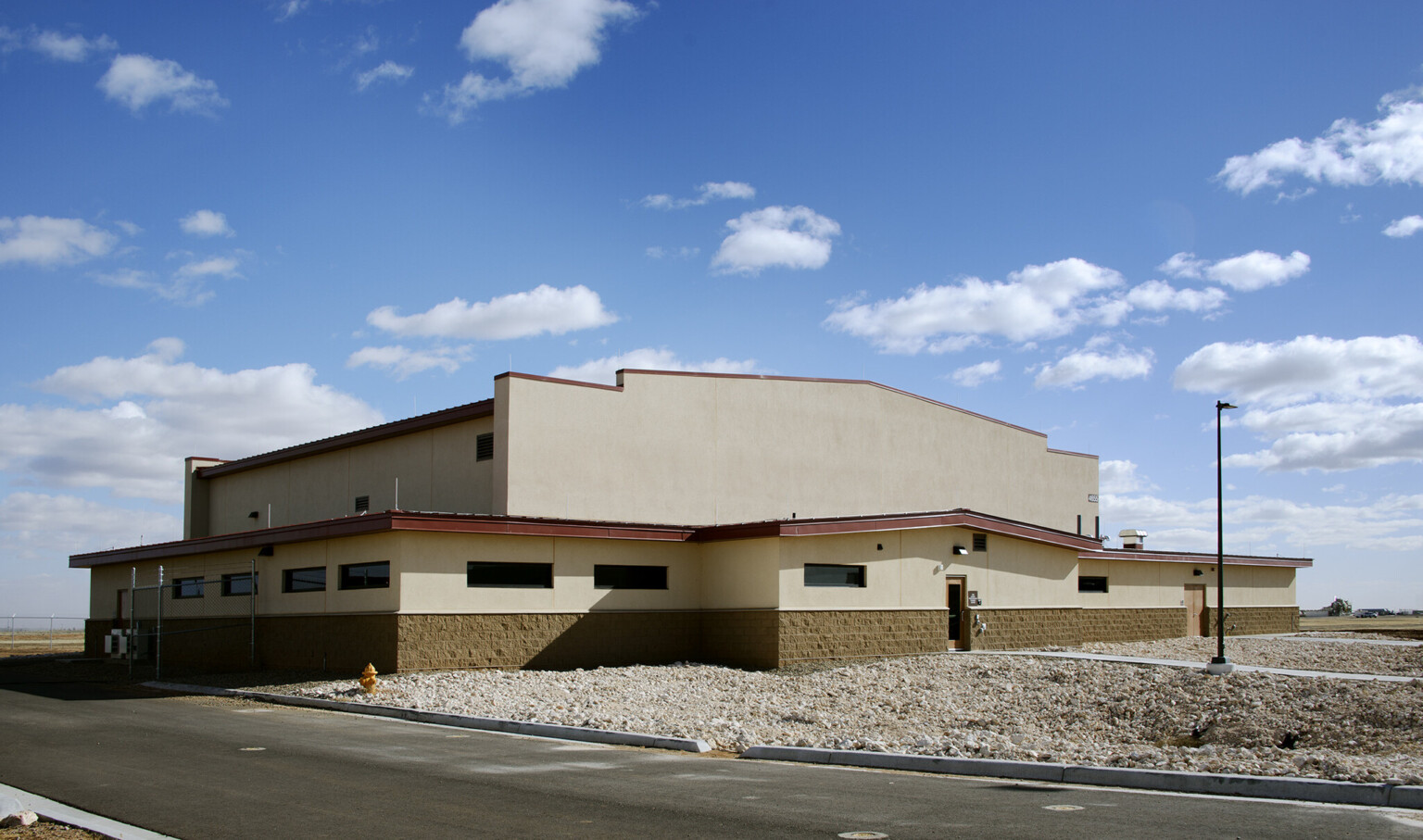 The Cannon Air Force Base Squadron Operations Facility uses mission-style architecture to meld seamlessly with the surrounding high plains and blue skies of eastern New Mexico