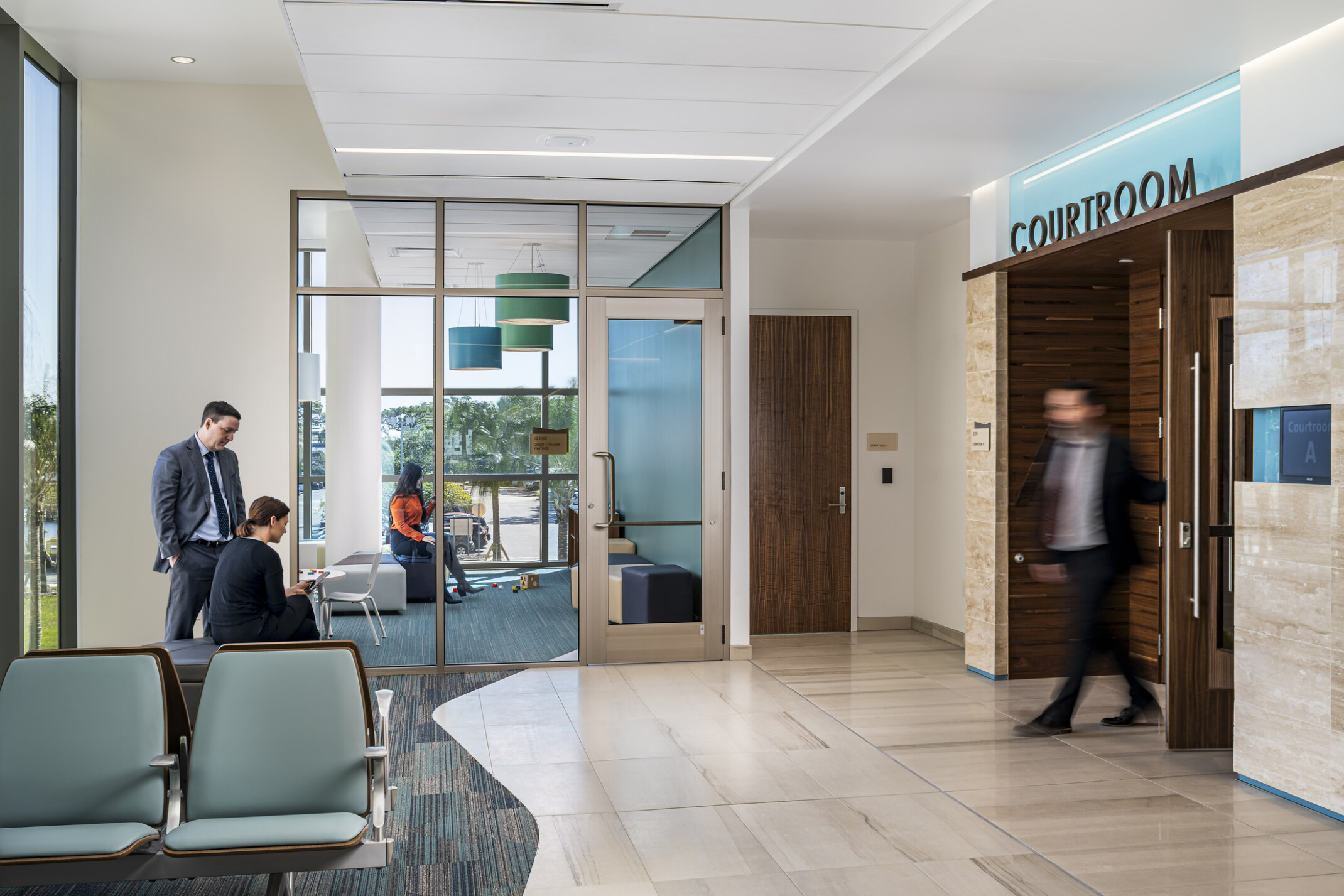 The Pinellas County Family Courts Child and Family Waiting Room is filled with daylight and a blue-green color palette