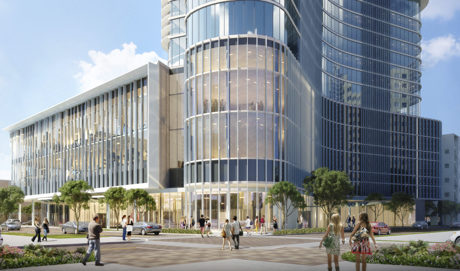 The Summa Orlando Hotel and Mixed Use Tower seen from the front, the glass lined building curved to rounded entry