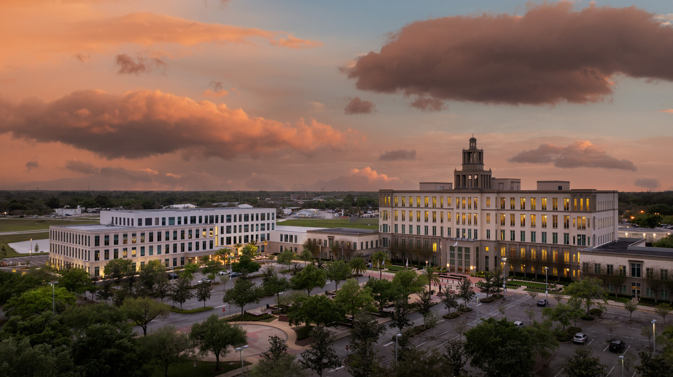 Aerial of the Seminole County Justice Center Annex with a large four-story courts building with a three tiered cupola to the right side of the image and a four-story government building to the left.