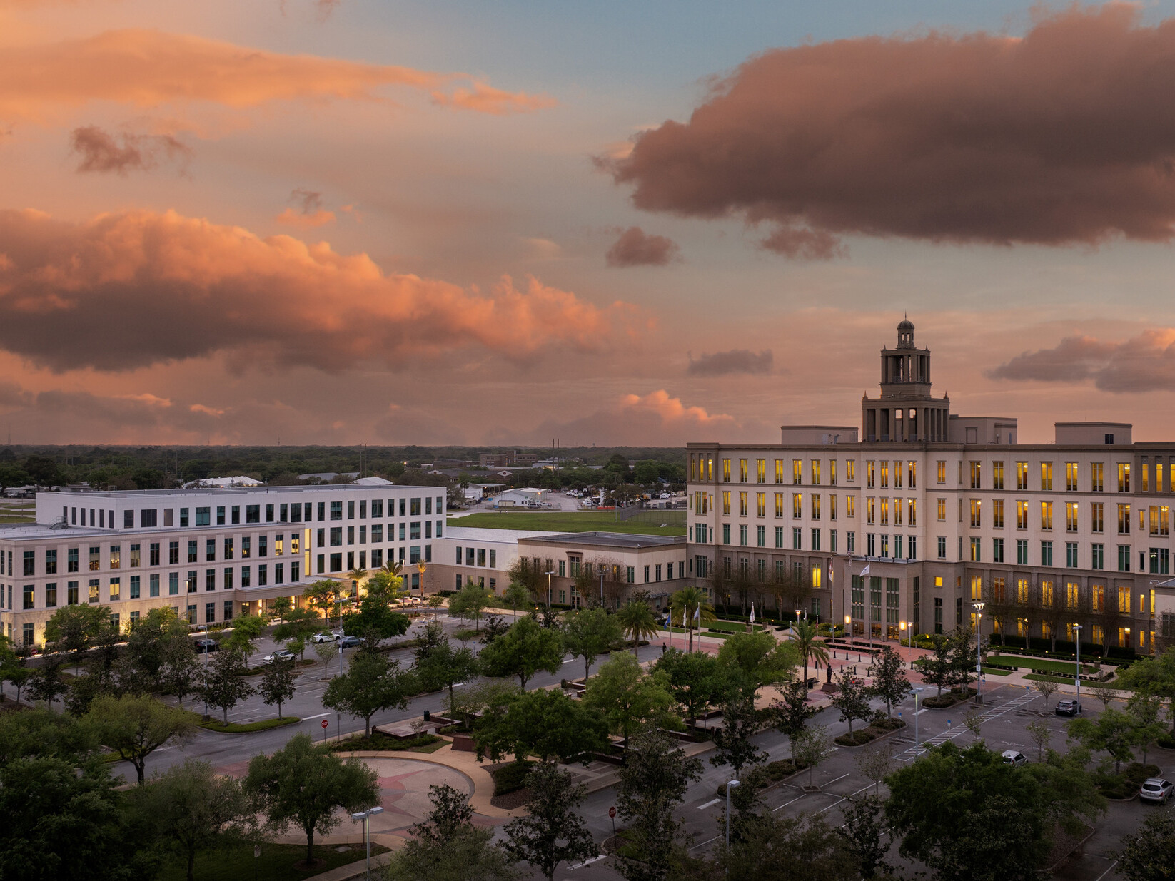 Aerial of the Seminole County Justice Center Annex with a large four-story courts building with a three tiered cupola to the right side of the image and a four-story government building to the left.