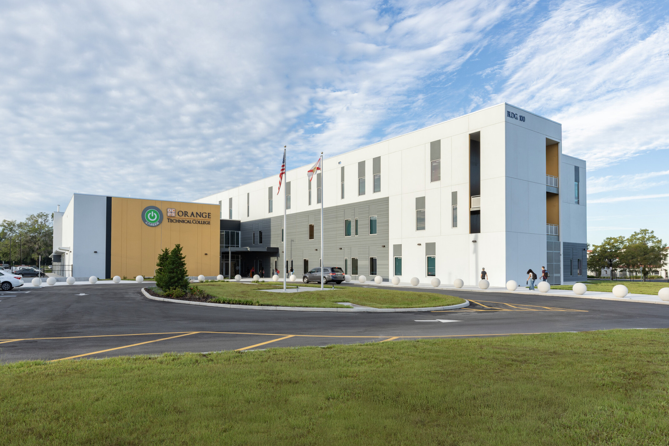 modern school building architectural rendering with large white facade perpendicular to a smaller yellow facade