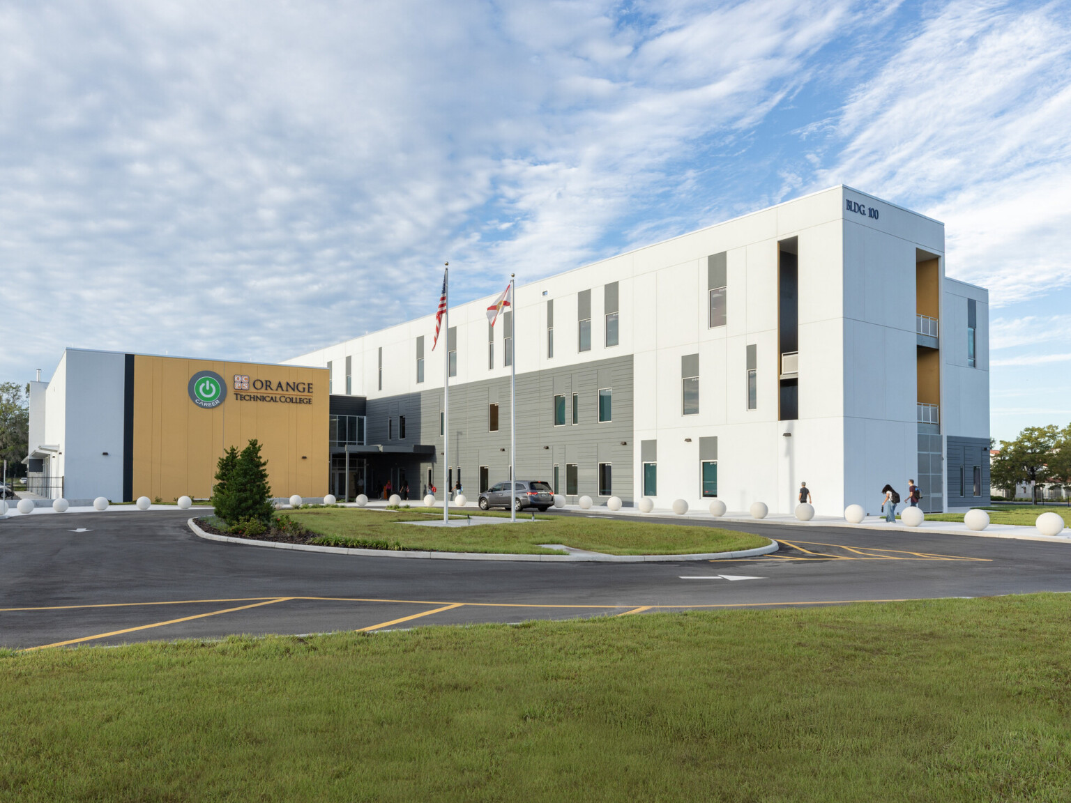 modern school building architectural rendering with large white facade perpendicular to a smaller yellow facade
