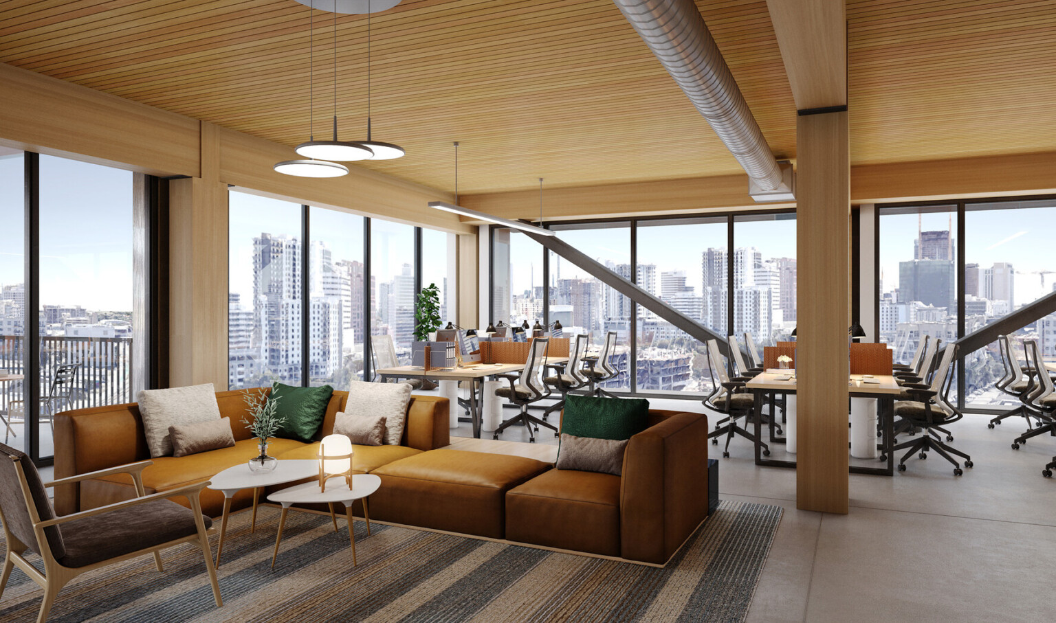 Rendering of the interior of an office space showing a seating area with brown leather couches in from of a desk space with wooden desks with white chairs on wheels