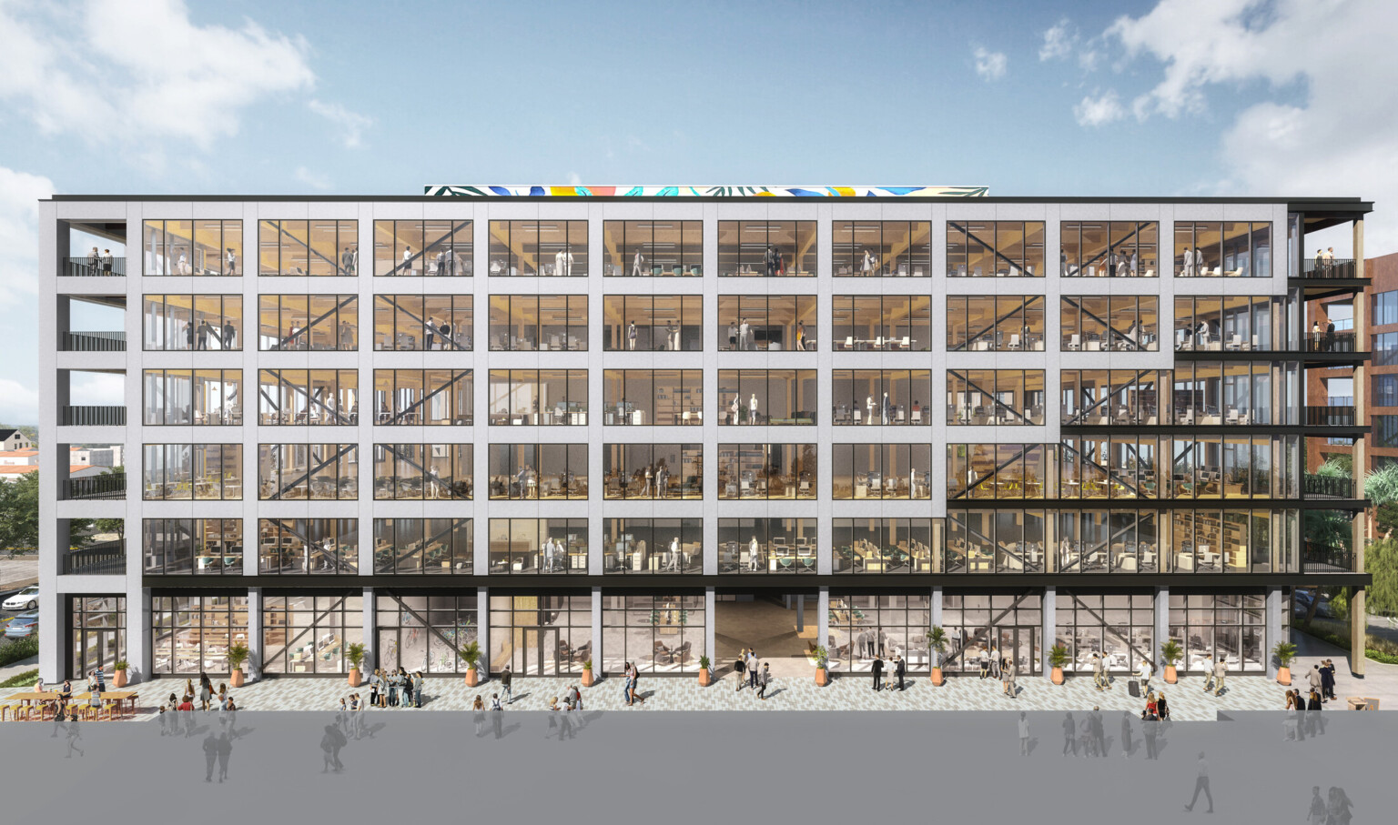 Modern multistory office building willed with windows outlined by white beams with black accents