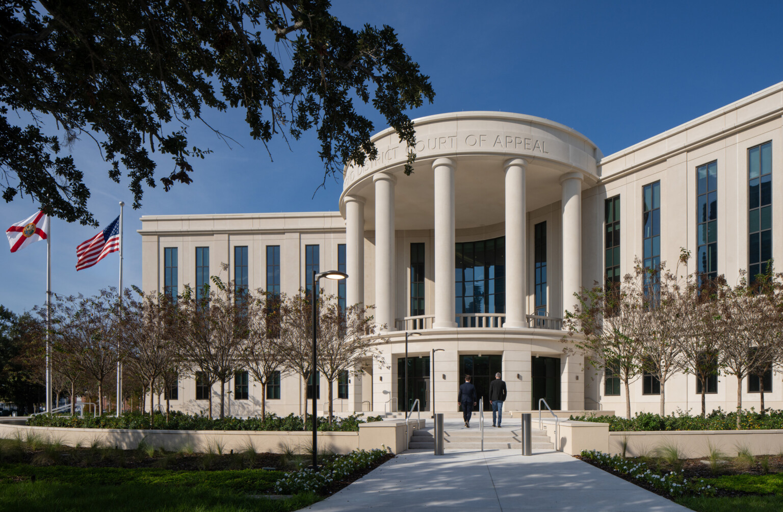 Front Approach for FL 2nd District Court of Appeal, Bernie McCabe Courthouse; columned and curved with large column like windows on the building face