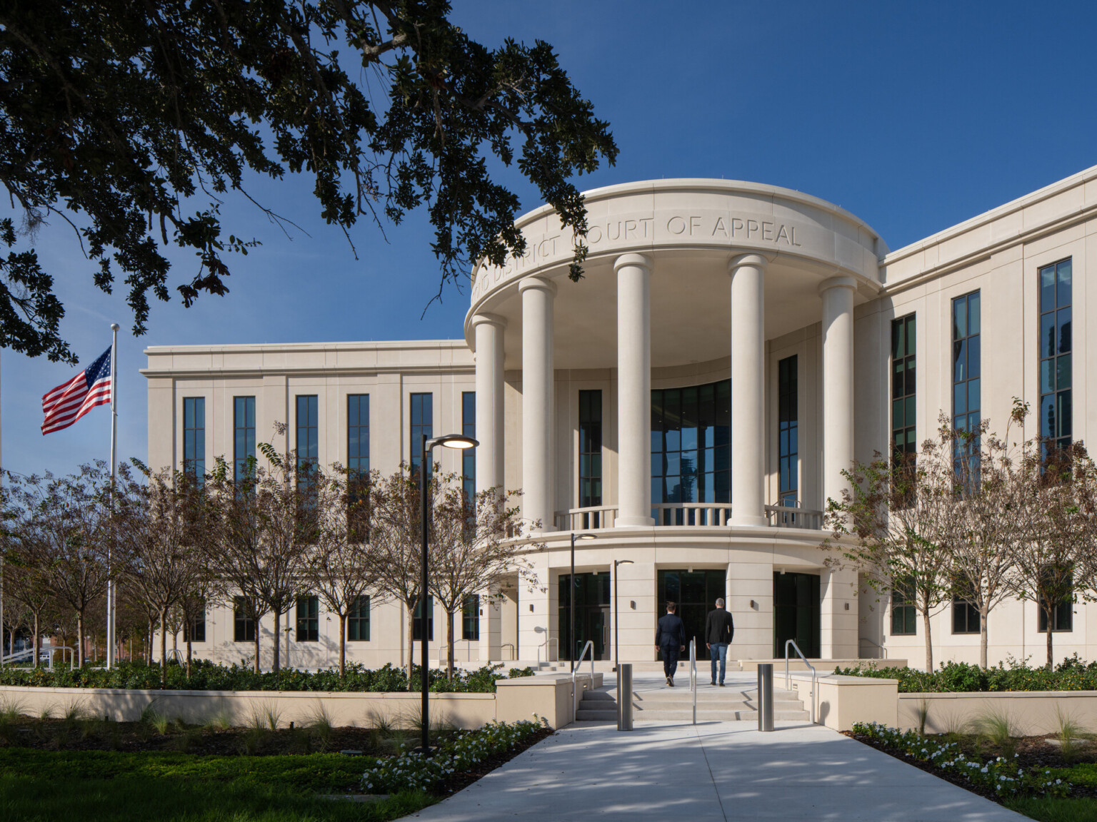 Front Approach for FL 2nd District Court of Appeal, Bernie McCabe Courthouse; columned and curved with large column like windows on the building face
