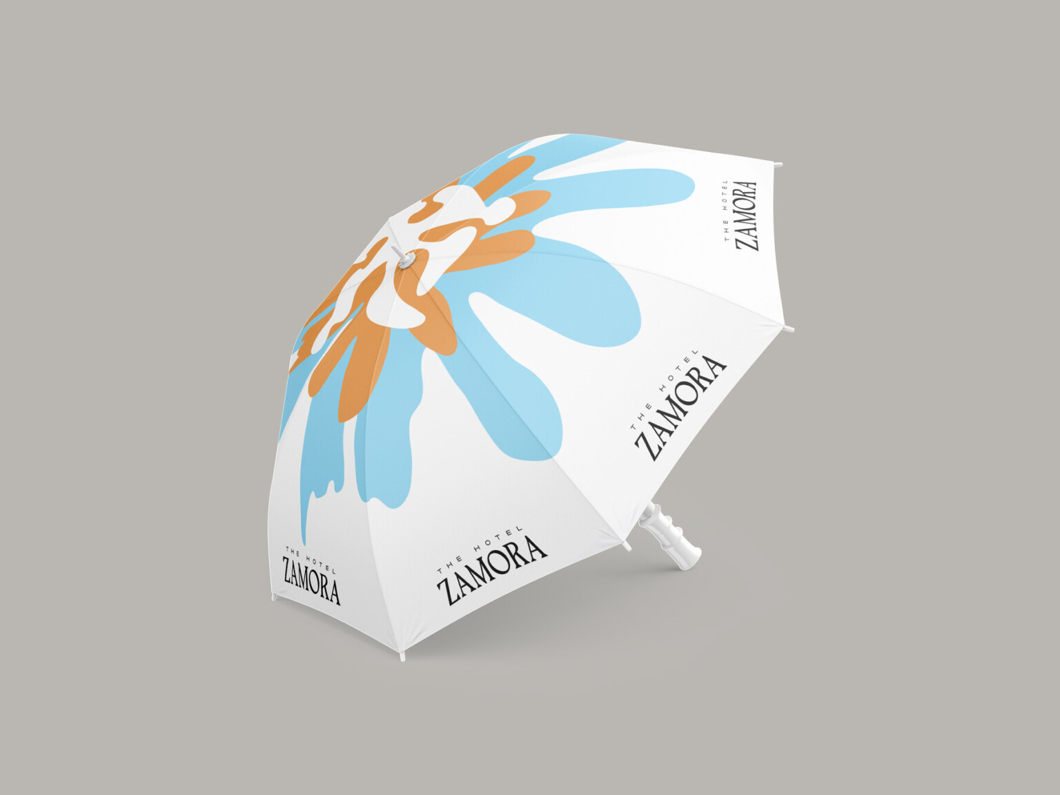 graphic design for hotel zamora; beach umbrella with a blue and yellow flower on the top