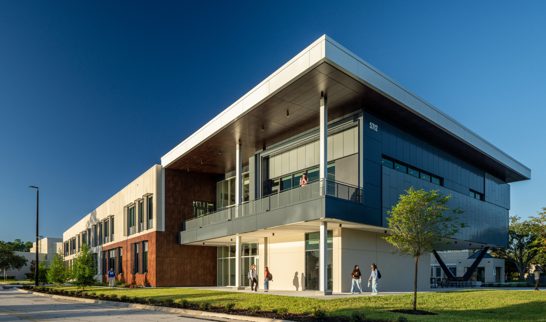 modern school science center with outdoor deck, campus quad and gateway
