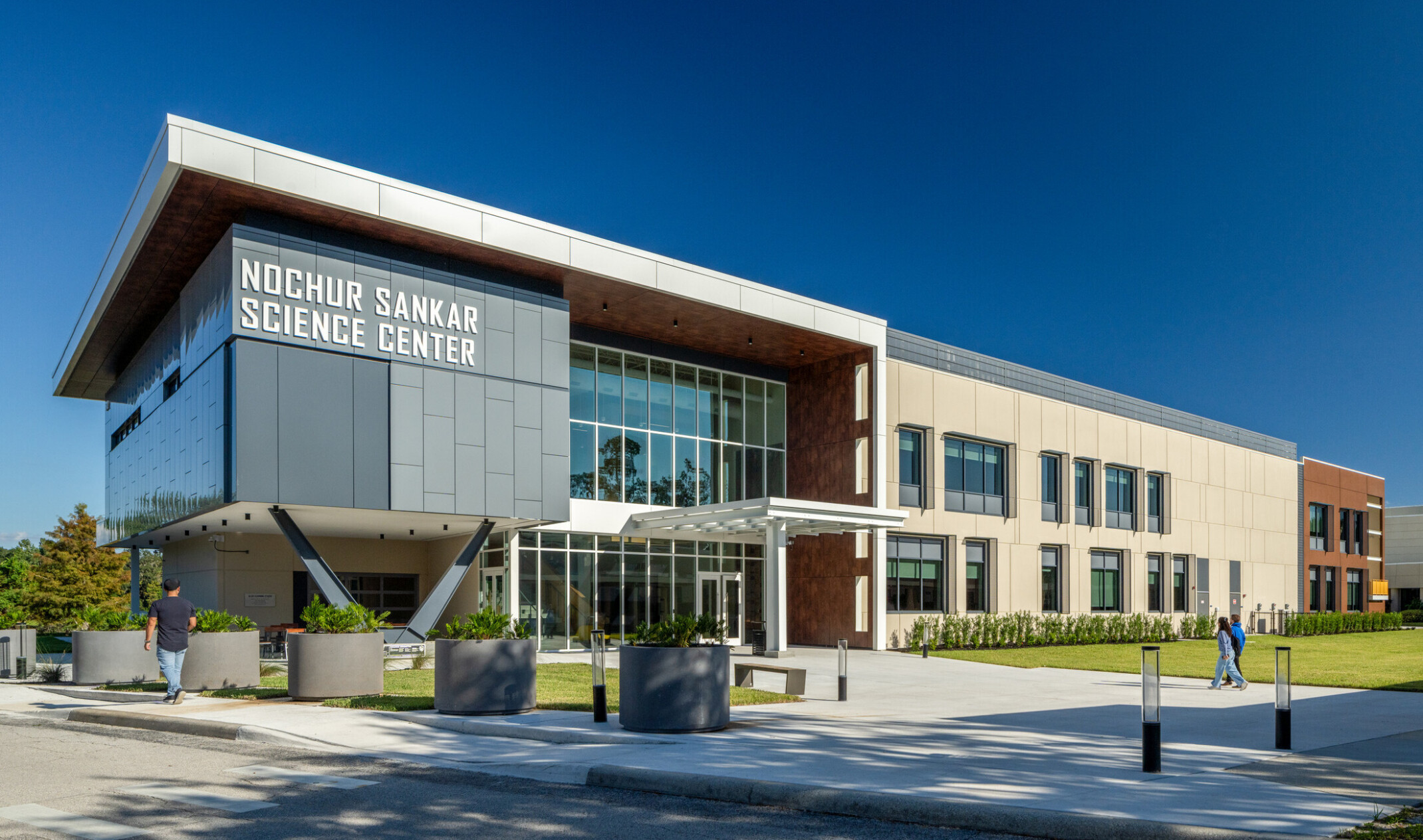 modern school science center with outdoor deck, campus quad and gateway
