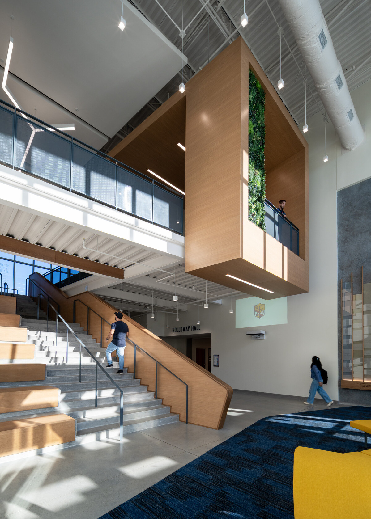 Double height space with modern school central learning stair with open circulation; 360 sightlines and seating