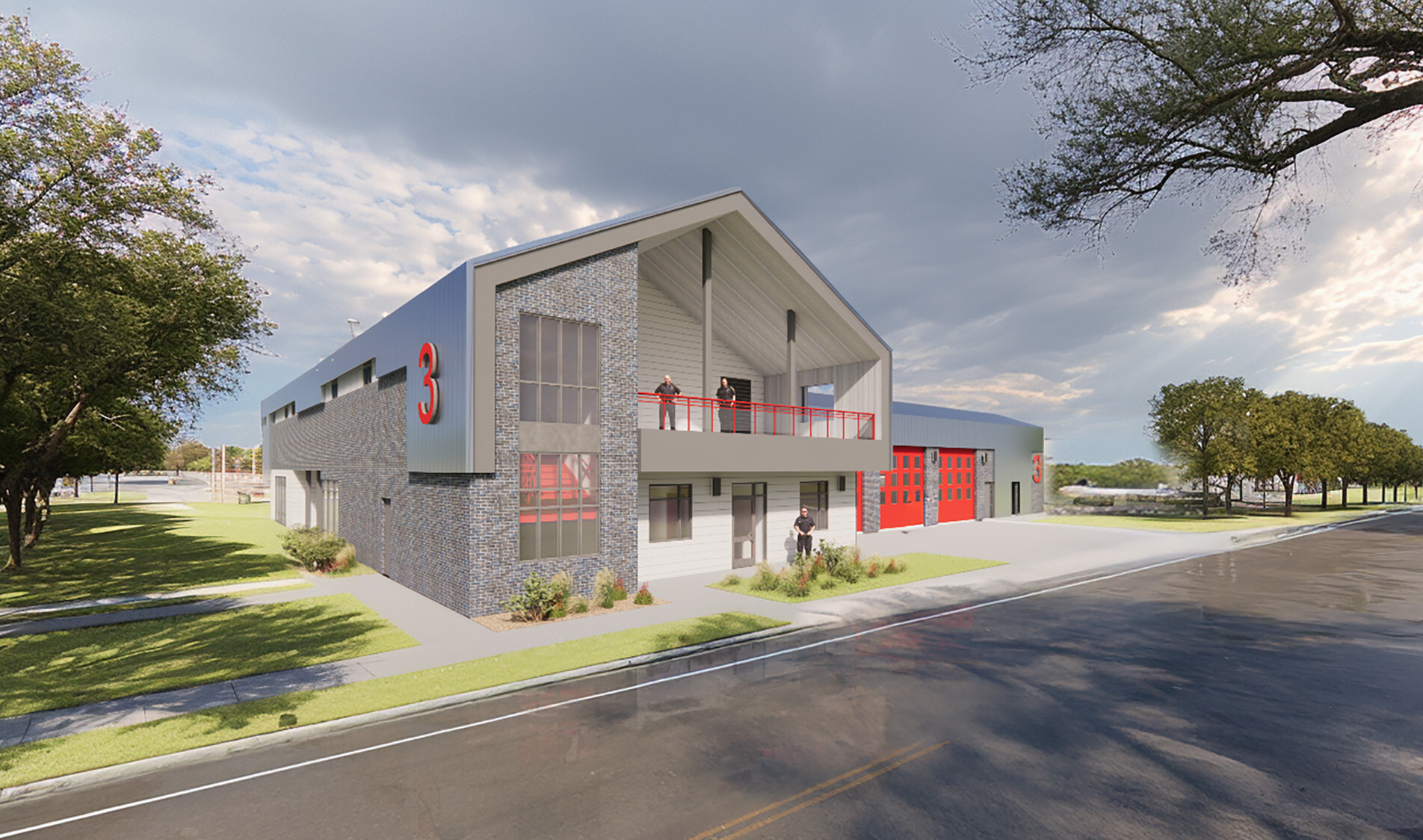 Front view of the two-story fire station. Gray brick façade with red accents.