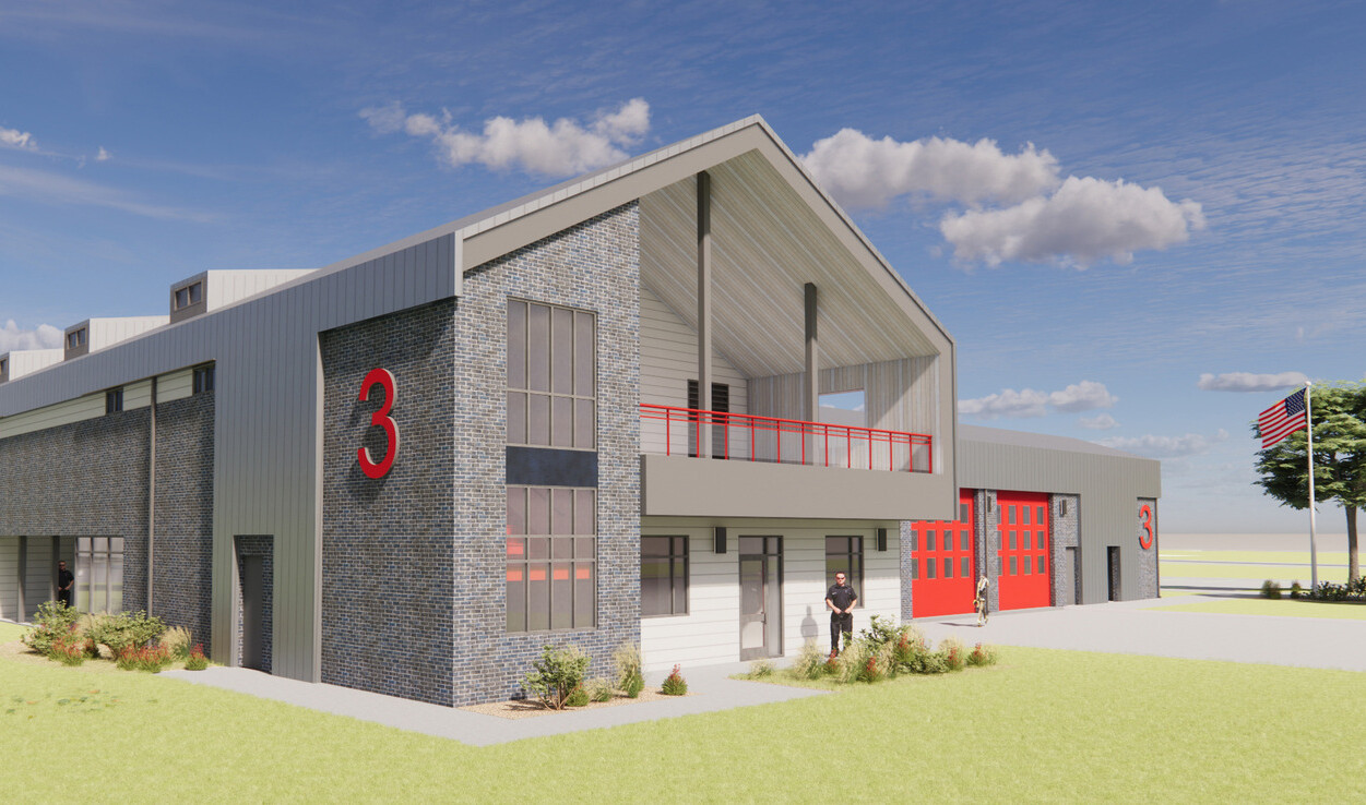 Corner view of two-story Gainesville Fire Rescue Station #3. Gray brick façade with red accents.