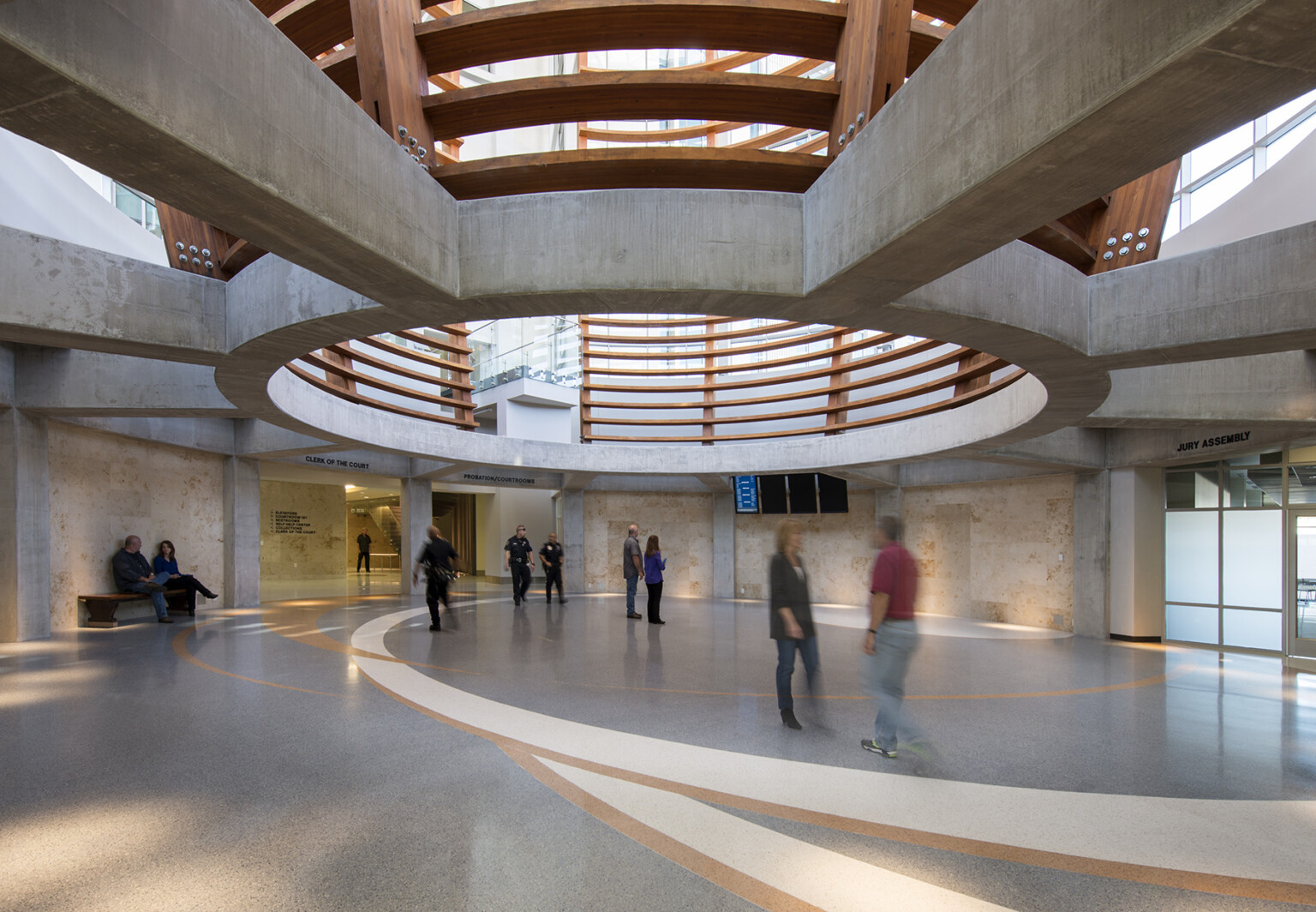 The lobby in the four-story central tower of Marysville Civic Campus welcomes residents and visitors, sets a new architectural standard for the city and engages with an adjacent city park, main entrance in the four-story central tower, and employs floor-to-ceiling privacy windows on the upper level