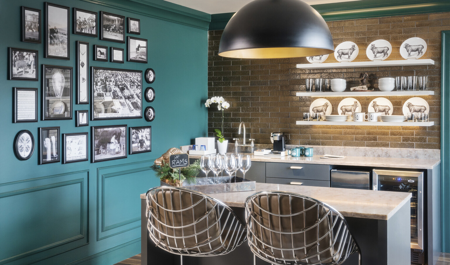 Green crown molding in room with left wall green and right wall brick over marble counter top with grey drawers