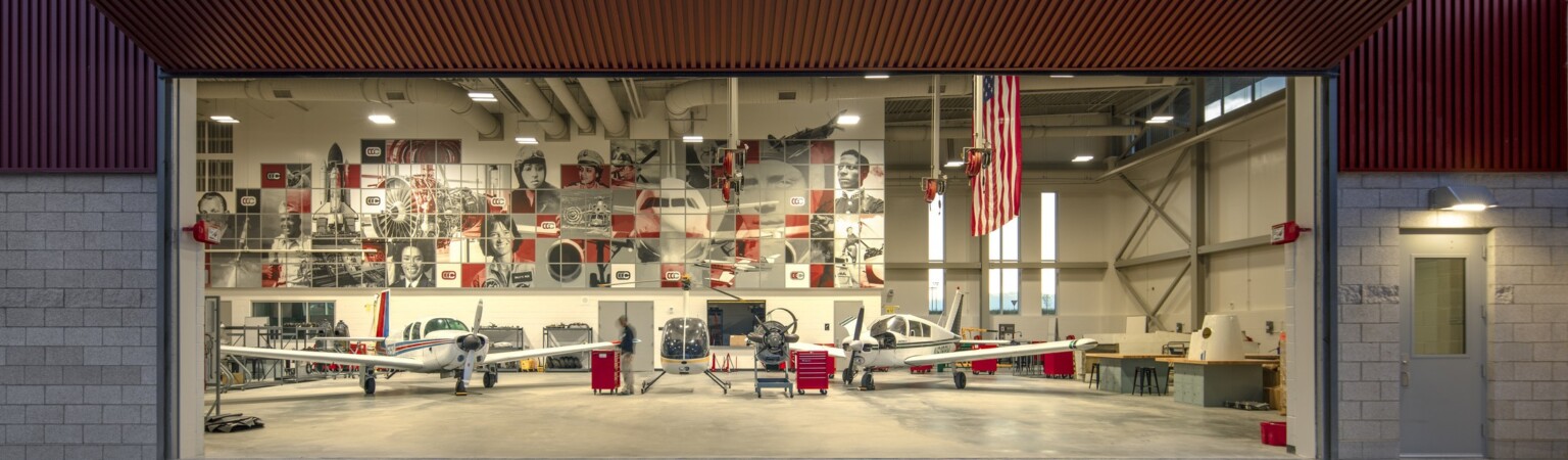 garage door opening to aviation learning area in a CTE education school, hands-on learning experience