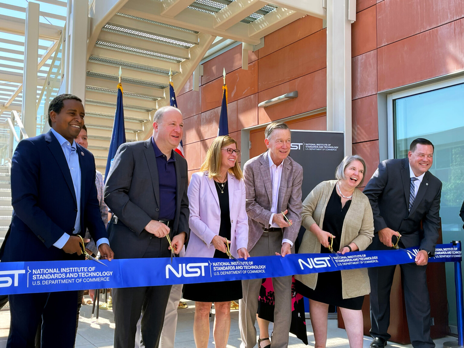 team cutting a ribbon National Institute of Standards and Technology Wing 5 Opens in Colorado