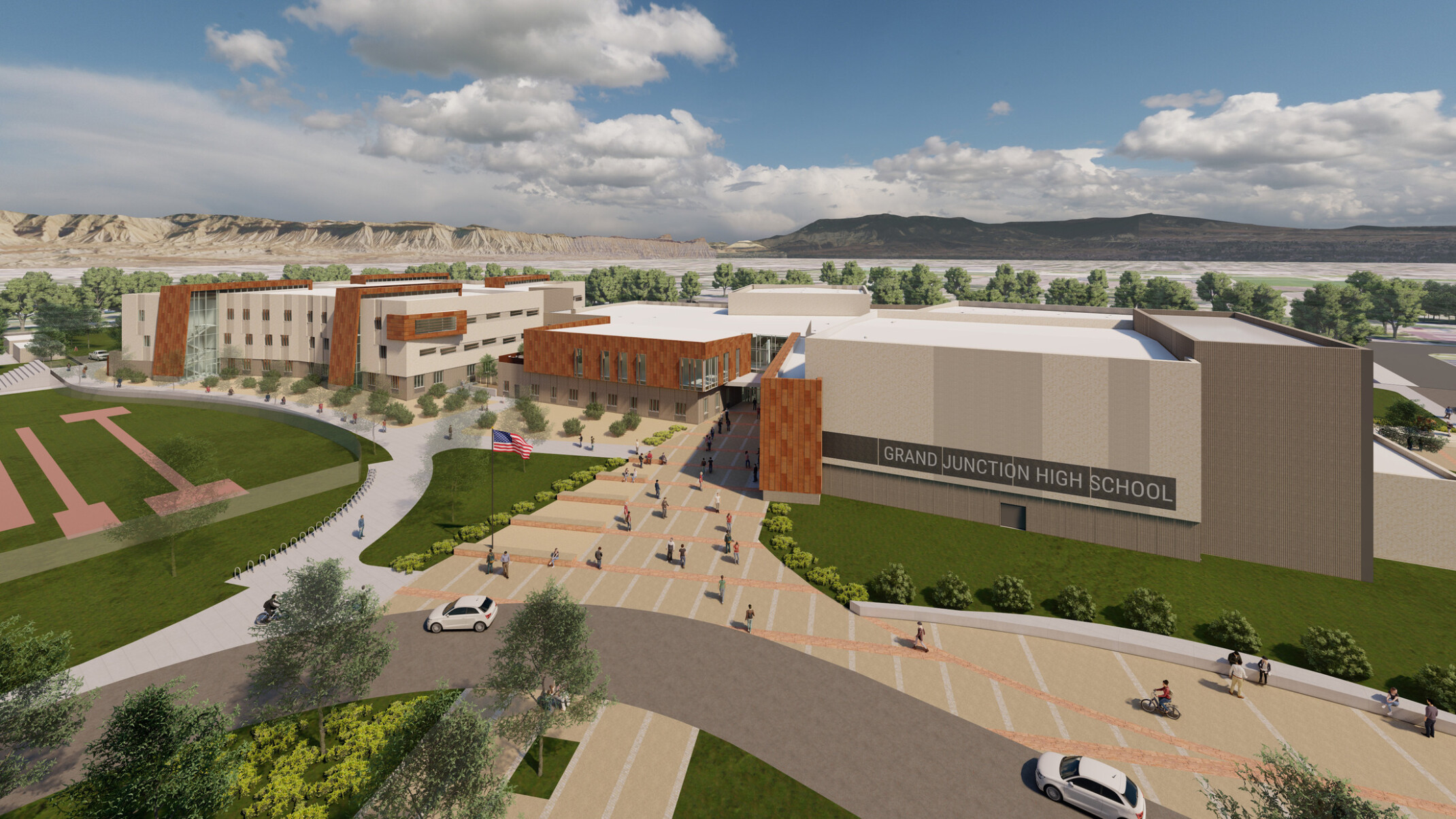long shot aerial view design concept, campus grounds, mass-timber and brick façade, signage, four academies, large windows, green space, trees, people on paved pathways, parking lot, mountains in distance, blue skies, puffy white clouds