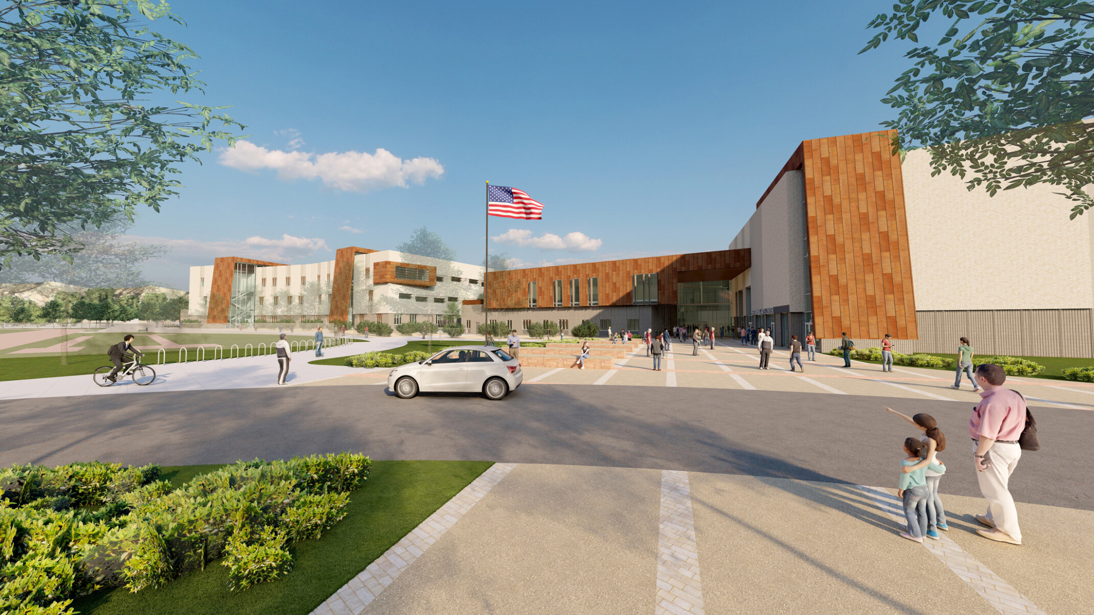 Rendering of a multistory high school with brown brick and white accents with a flag pole out front