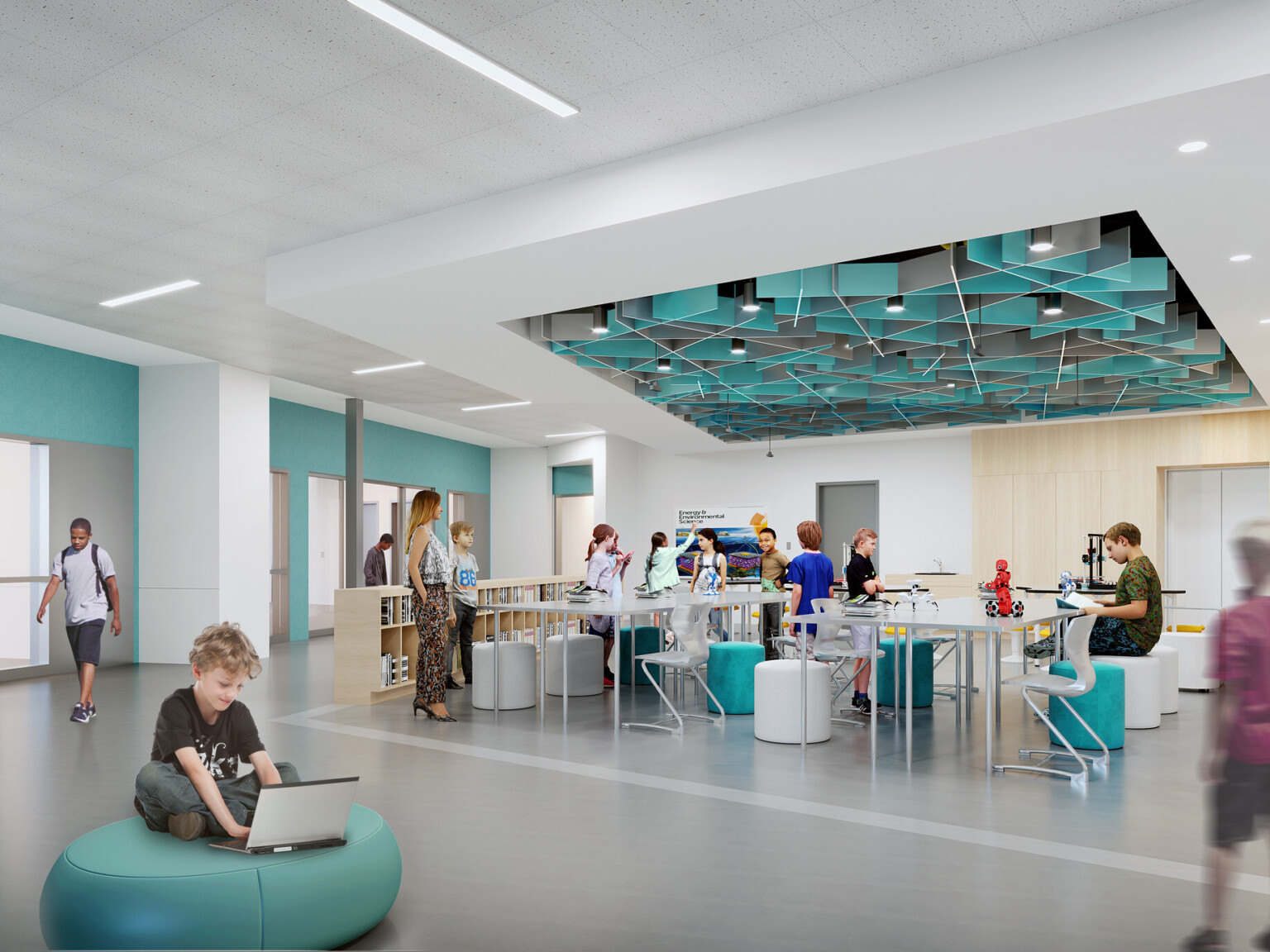 learning area with high ceilings, white walls with turquoise accent elements, low book shelves, geometric turquoise ceiling sculpture, polished concrete flooring, colorful stools, beanbags and white boards throughout, interior design and geometry elements support a sense of wonder for students to explore as they grow