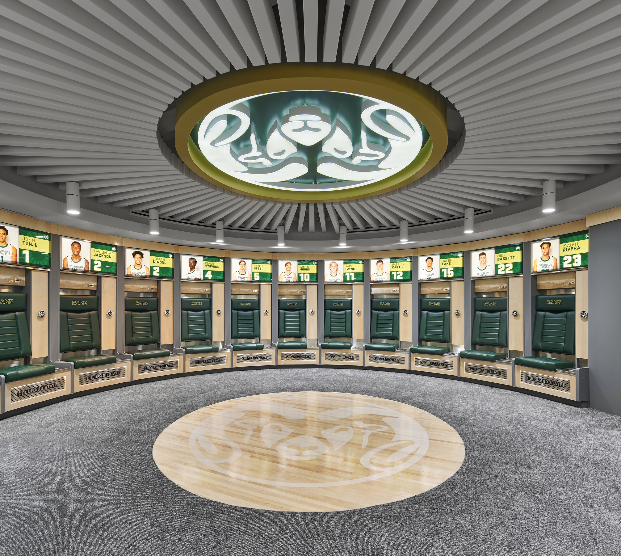 team branding, large Rams logo emblem adorns the ceiling, personalized lockers for the athletes with illuminated photo, name, and jersey number of each athlete's locker with private seating
