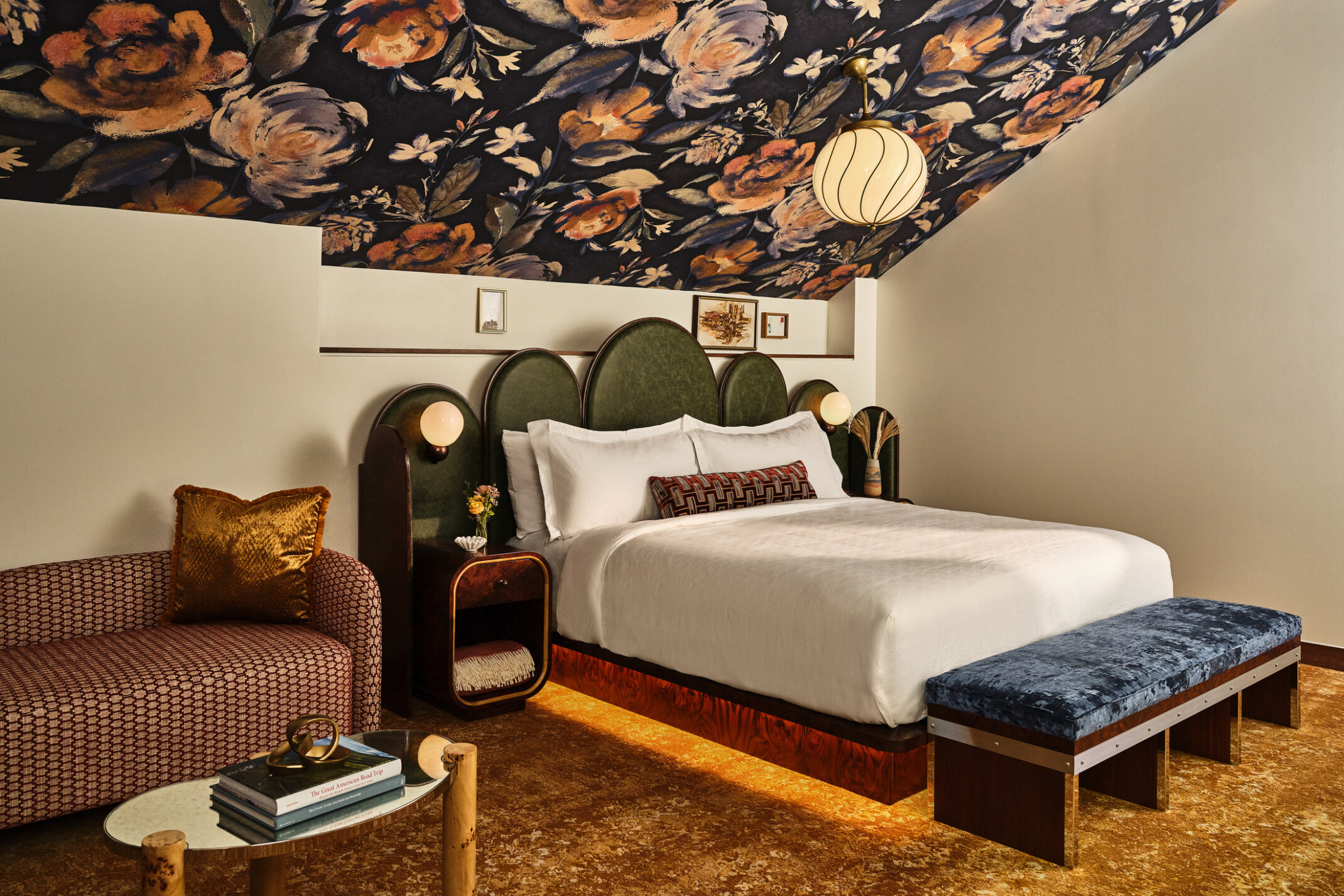 boutique hotel room at the Crawford Hotel at Denver Union Station, lush textures on benches, couches, headboard, and modernist interior design