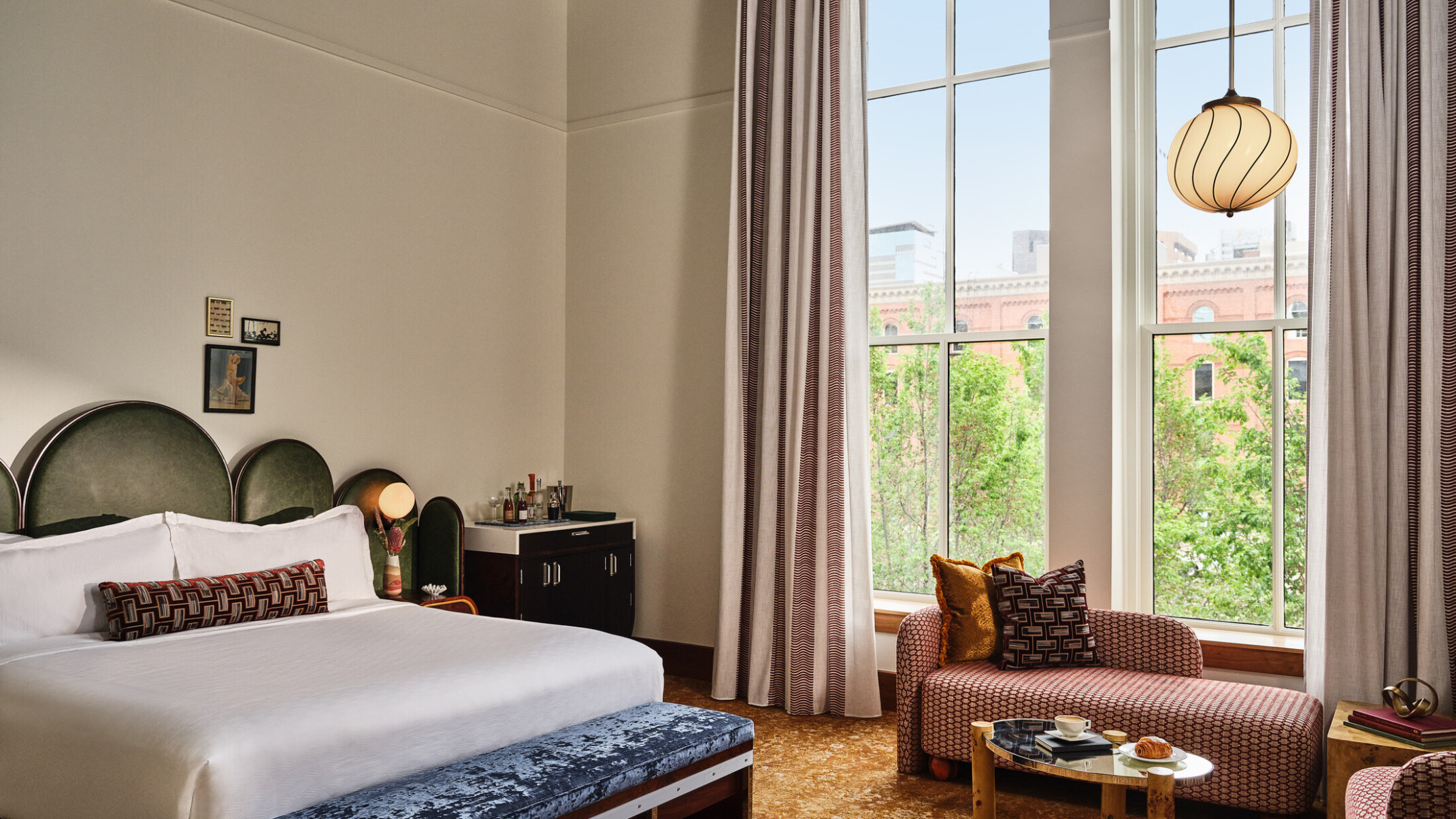 boutique hotel room at the Crawford Hotel at Denver Union Station, lush textures on benches, couches, headboard, and modernist interior design