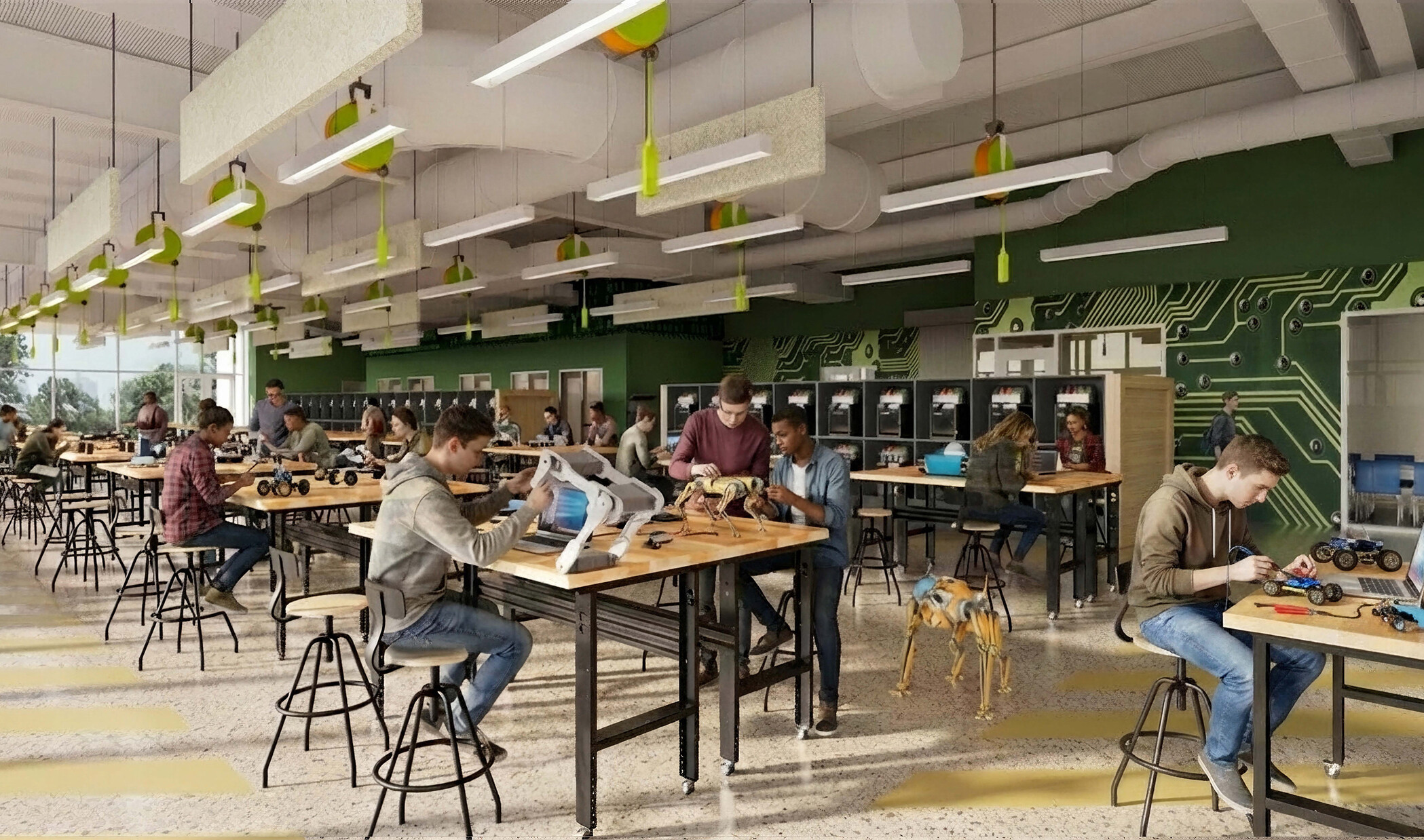 students sitting and working at stations in a technical classroom with 3D printers; materials; etc.
